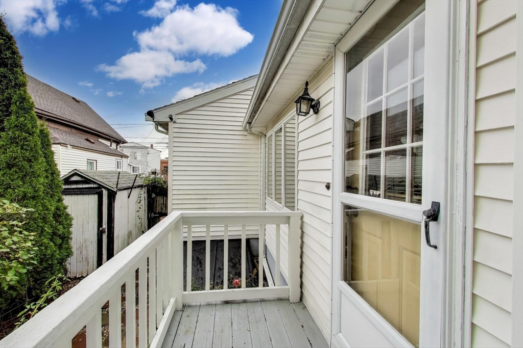 3 River St Court Lynn, MA 01905 - Photo 21 of 24 a view of balcony with wooden floor and fence