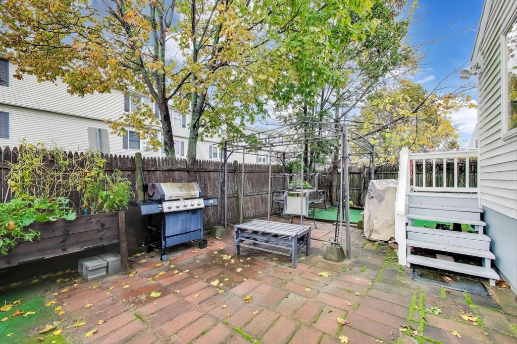3 River St Court Lynn, MA 01905 - Photo 23 of 24 a view of a patio with a table and chairs in a patio