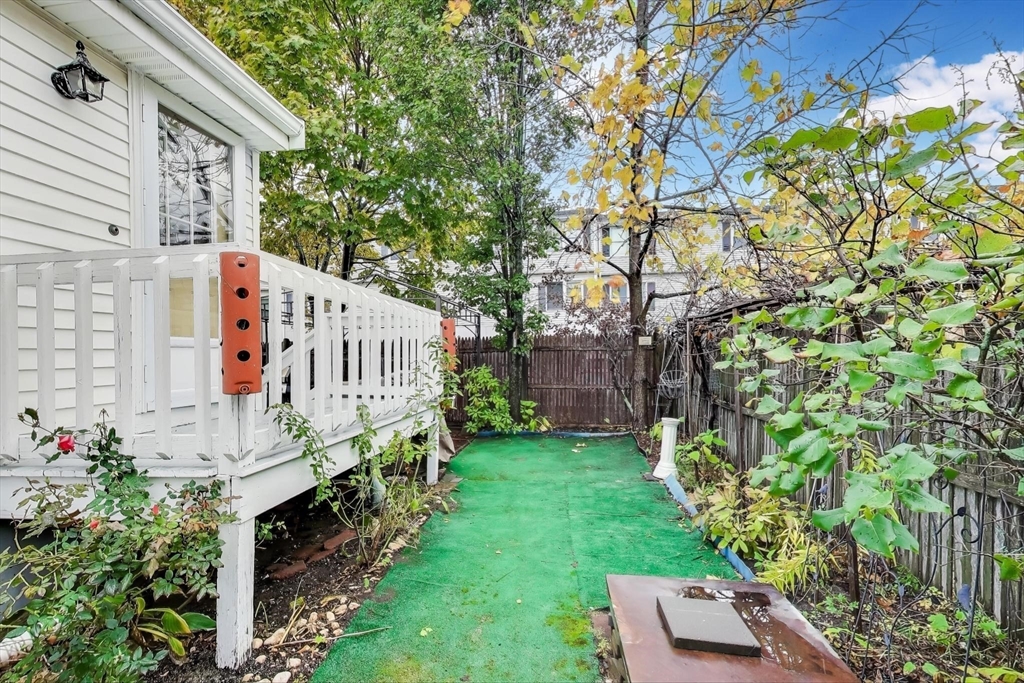 3 River St Court Lynn, MA 01905 - Photo 24 of 24 a view of backyard with deck and flowers