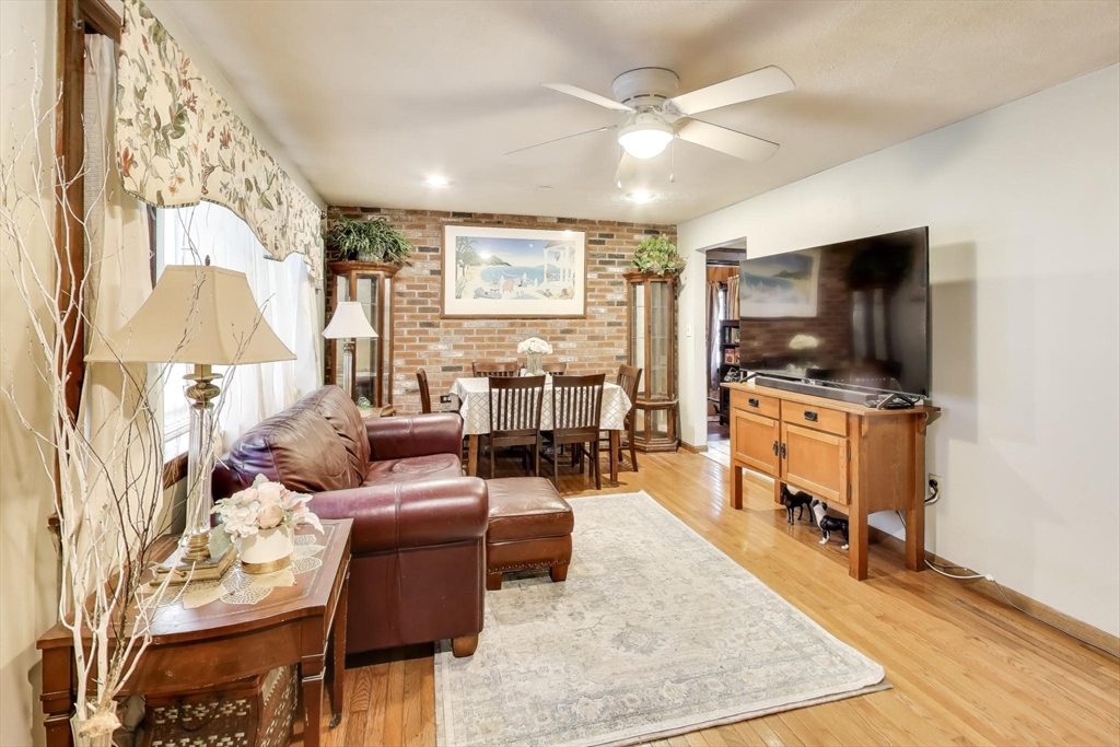 3 River St Court Lynn, MA 01905 - Photo 4 of 24 a living room with furniture and a flat screen tv