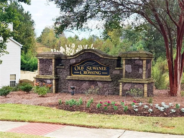 a sign that is on a brick wall