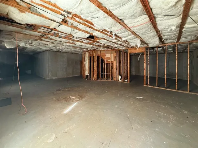 a view of a room with wooden walls