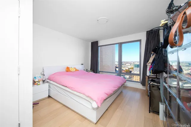 a bathroom with a sink vanity mirror and toilet