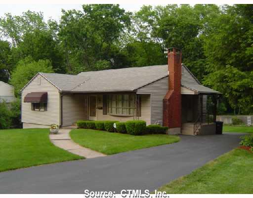 a view of a yard in front view of a house