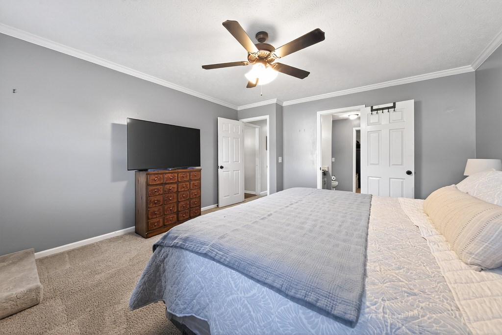 7333 Cedar Creek Loop Columbus, GA 31904 - Photo 18 of 37 a bedroom with a bed and a flat screen tv