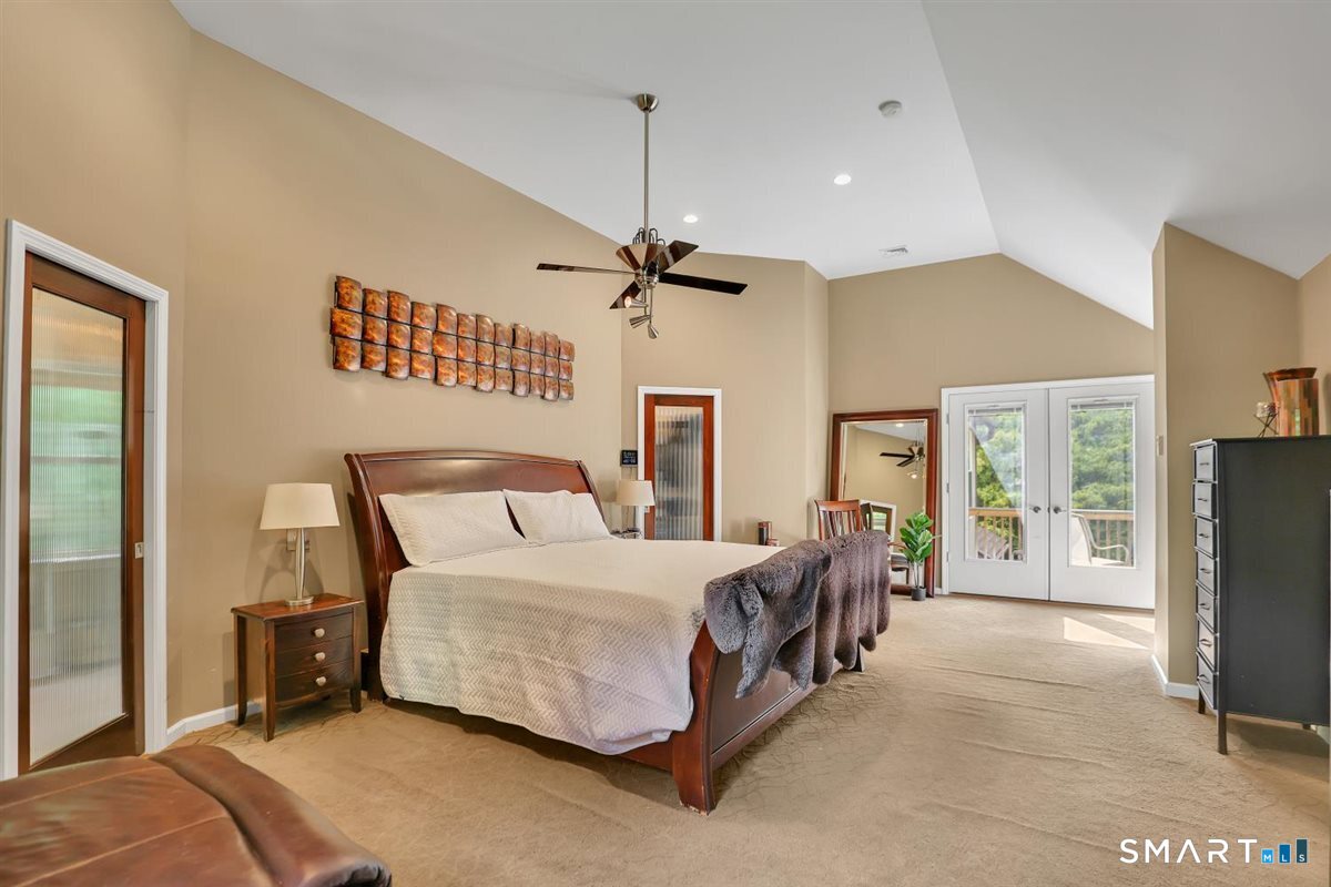 122 Ridgeview Circle Guilford, CT 06437 - Photo 11 of 40 The spacious master suite features TWO generously sized walk-in closets; each with high ceilings, Palladian windows, and custom built-ins. No need to share... there's plenty of room for everyone!