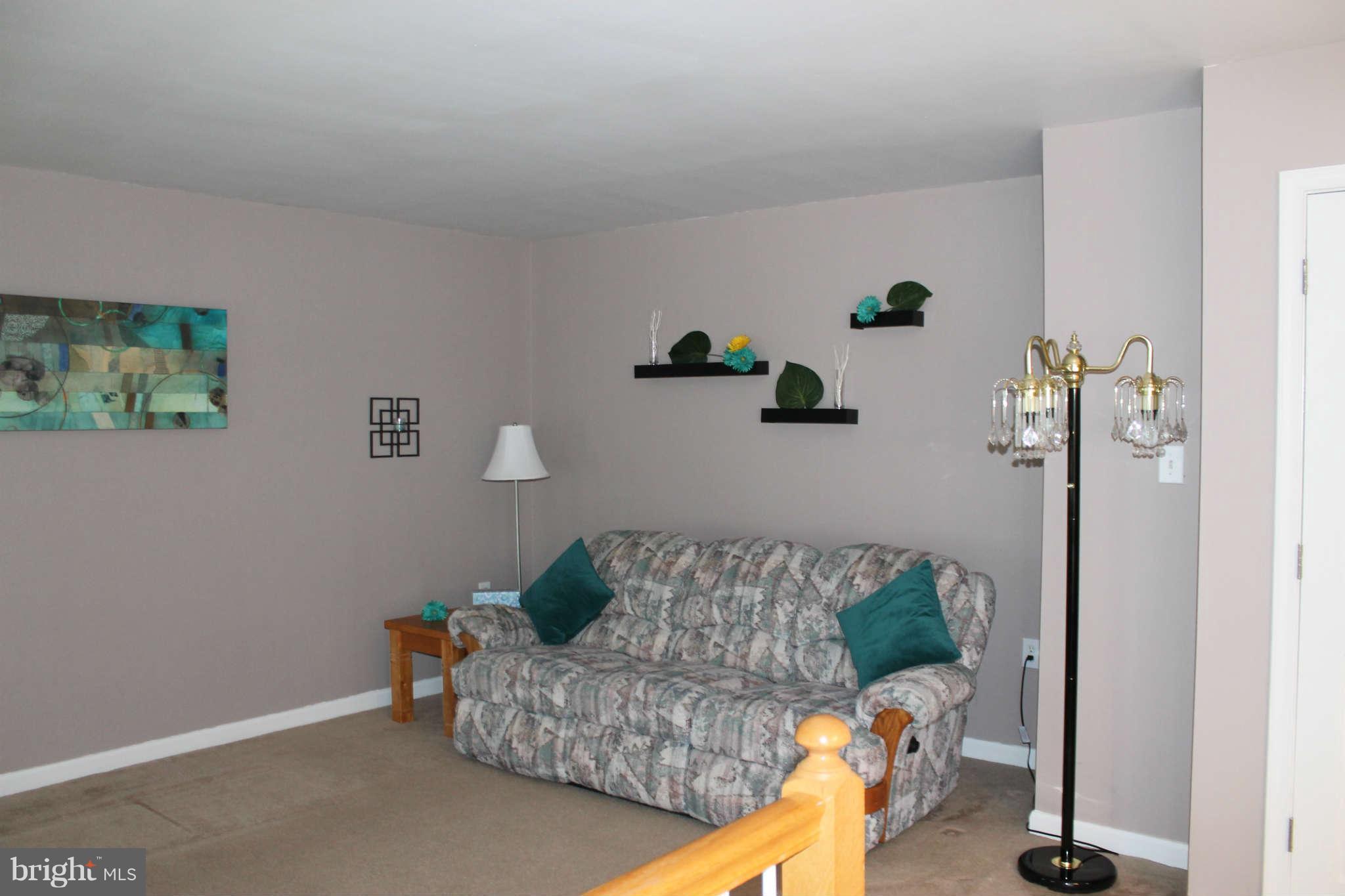 107 Estate Lane Ranson, WV 25438 - Photo 15 of 30 a living room with furniture and a couch