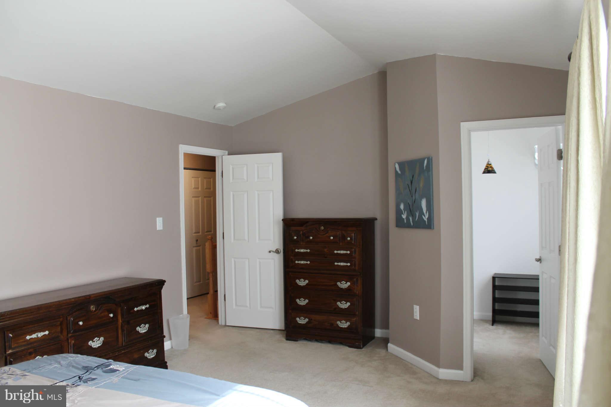 107 Estate Lane Ranson, WV 25438 - Photo 18 of 30 a room with a dresser and a mirror