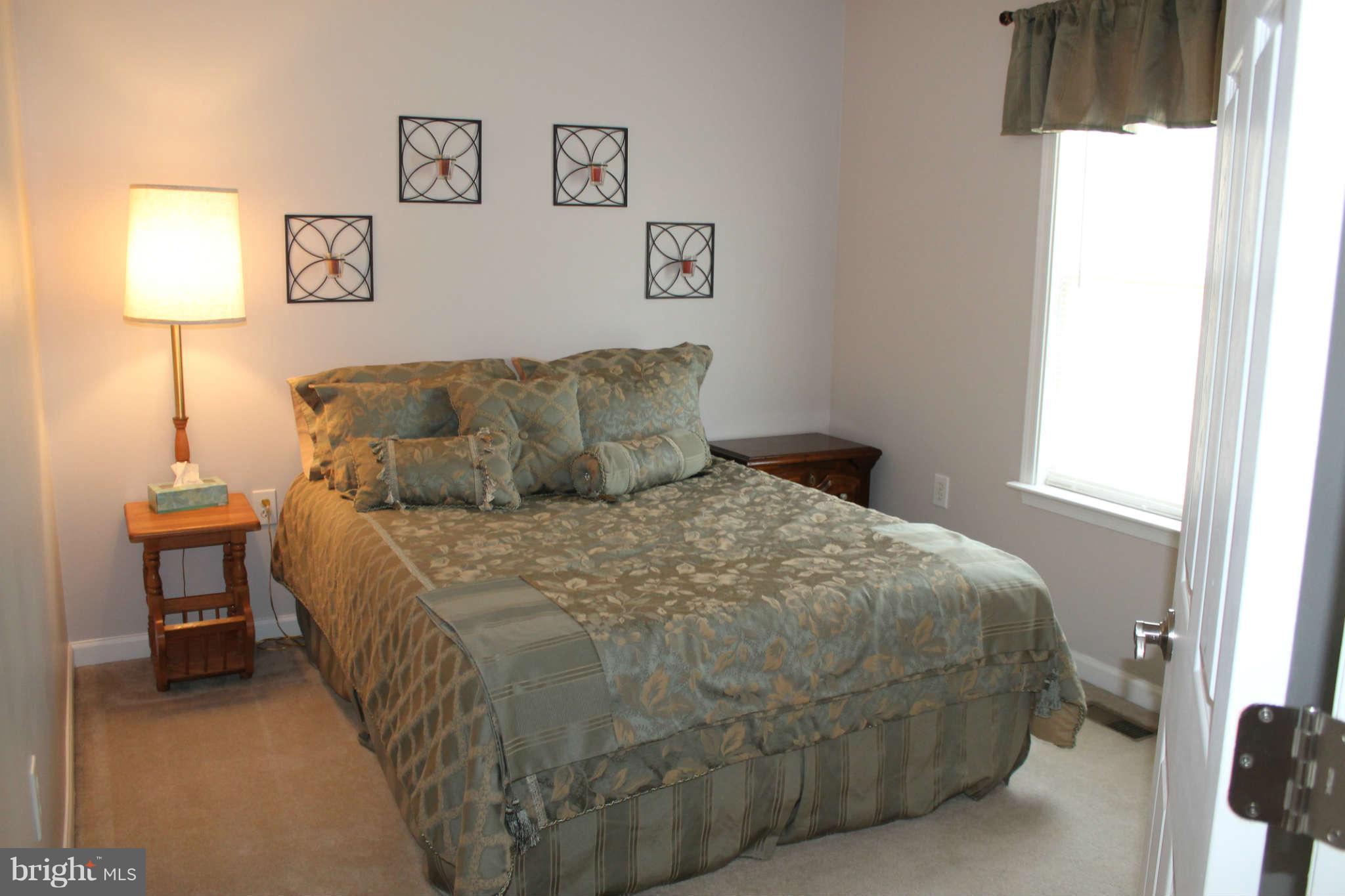 107 Estate Lane Ranson, WV 25438 - Photo 22 of 30 a bedroom with a bed and a window