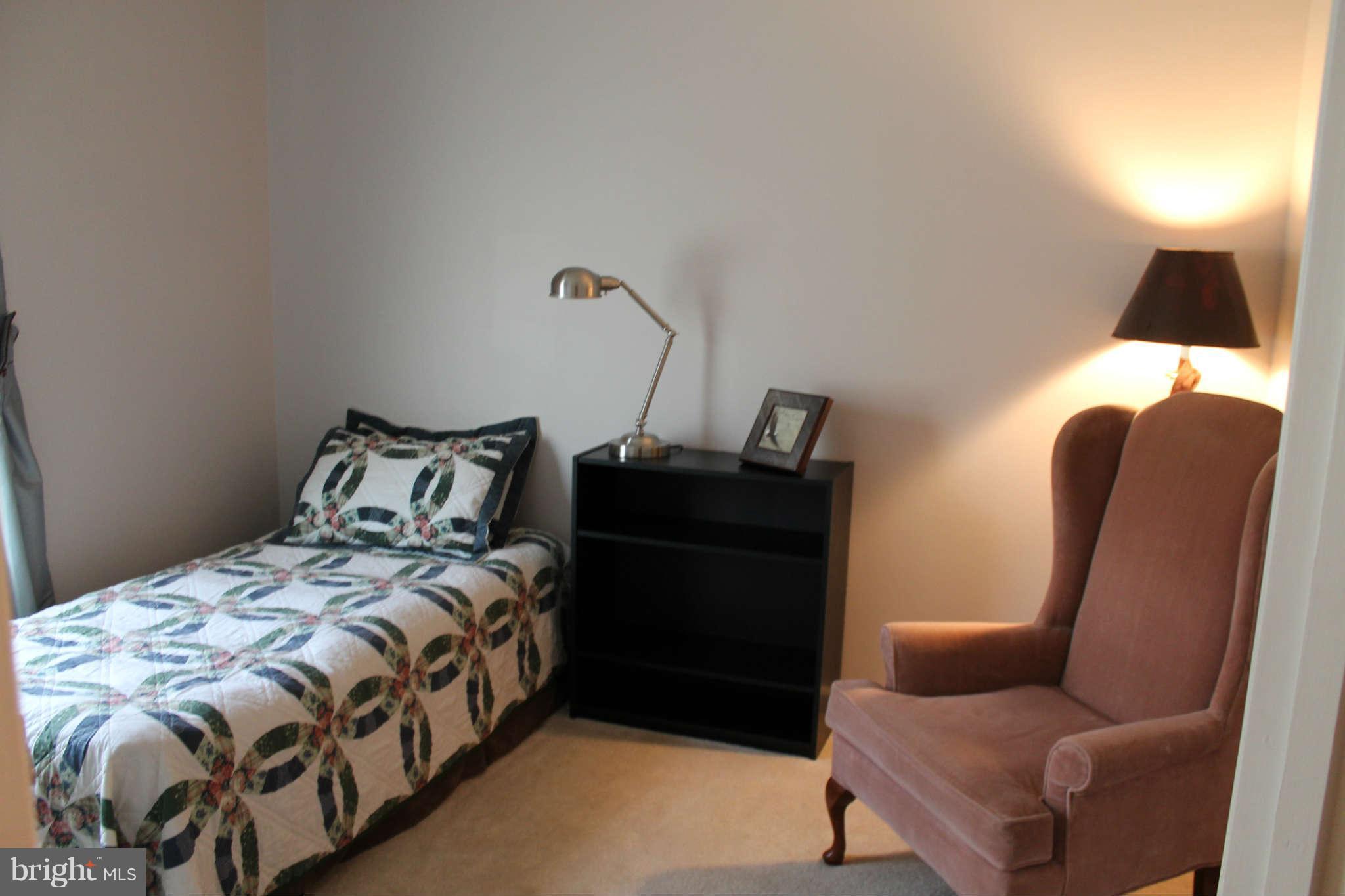 107 Estate Lane Ranson, WV 25438 - Photo 23 of 30 a bedroom with a bed and wooden floor