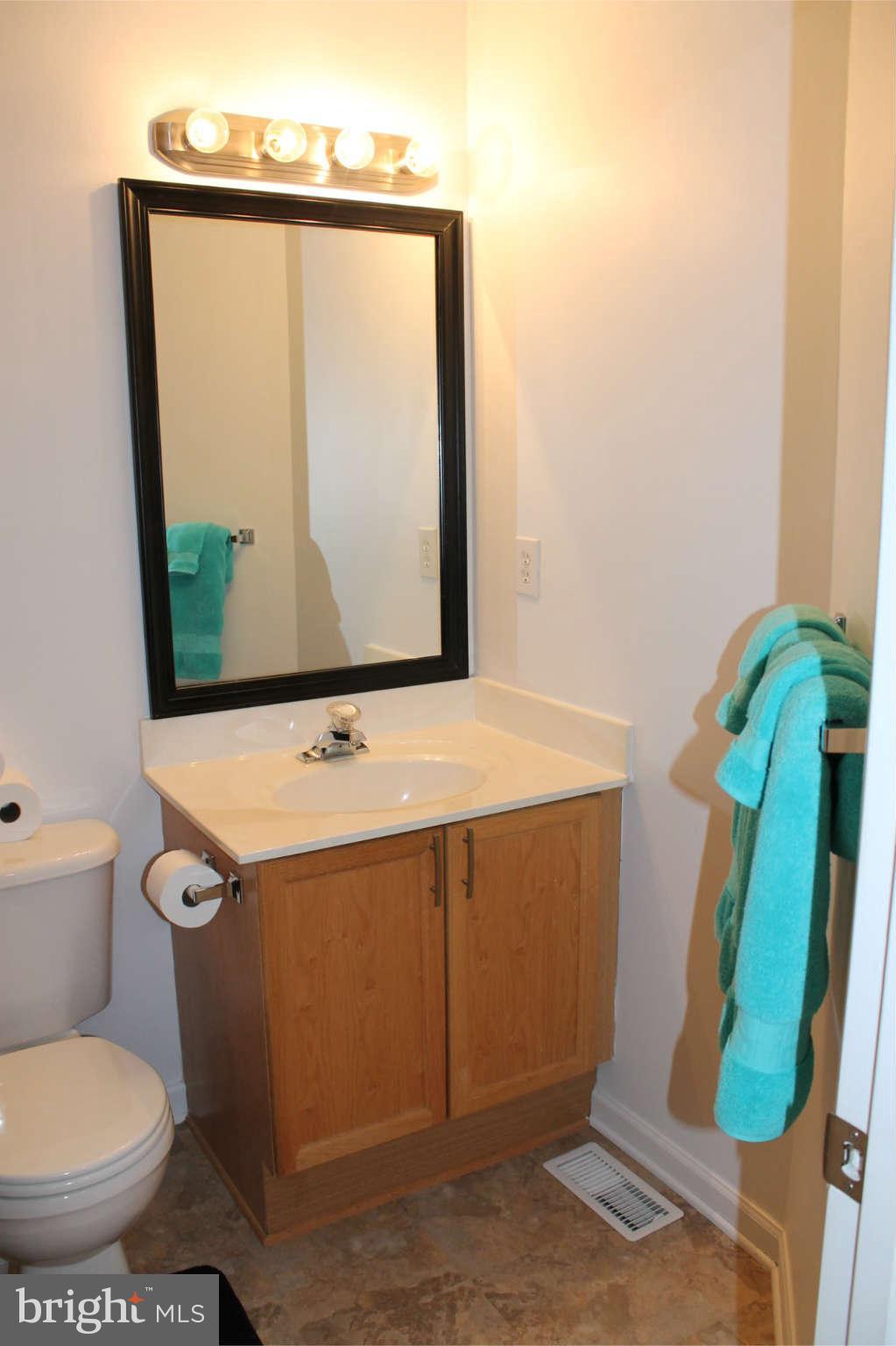 107 Estate Lane Ranson, WV 25438 - Photo 25 of 30 a bathroom with a toilet and a mirror