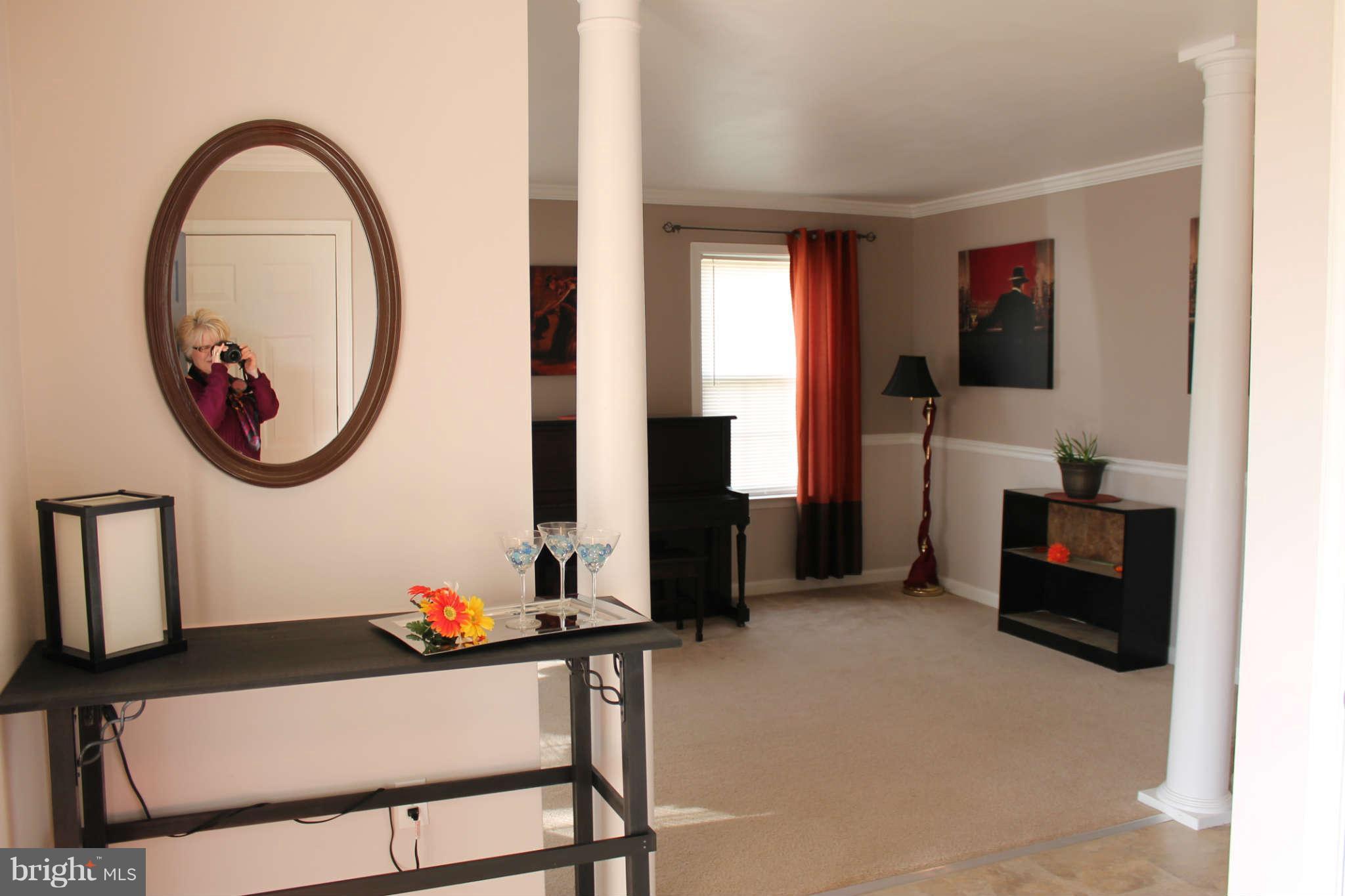 107 Estate Lane Ranson, WV 25438 - Photo 6 of 30 a living room with furniture and a mirror