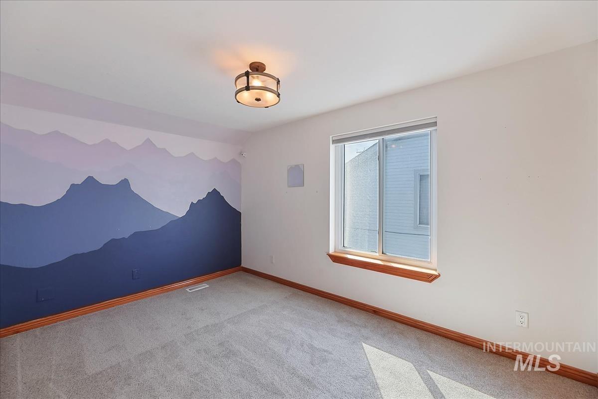 2804 West Sunrise Rim Road Boise, ID 83705 - Photo 34 of 50 Interior room with a decorative mountain mural accent wall