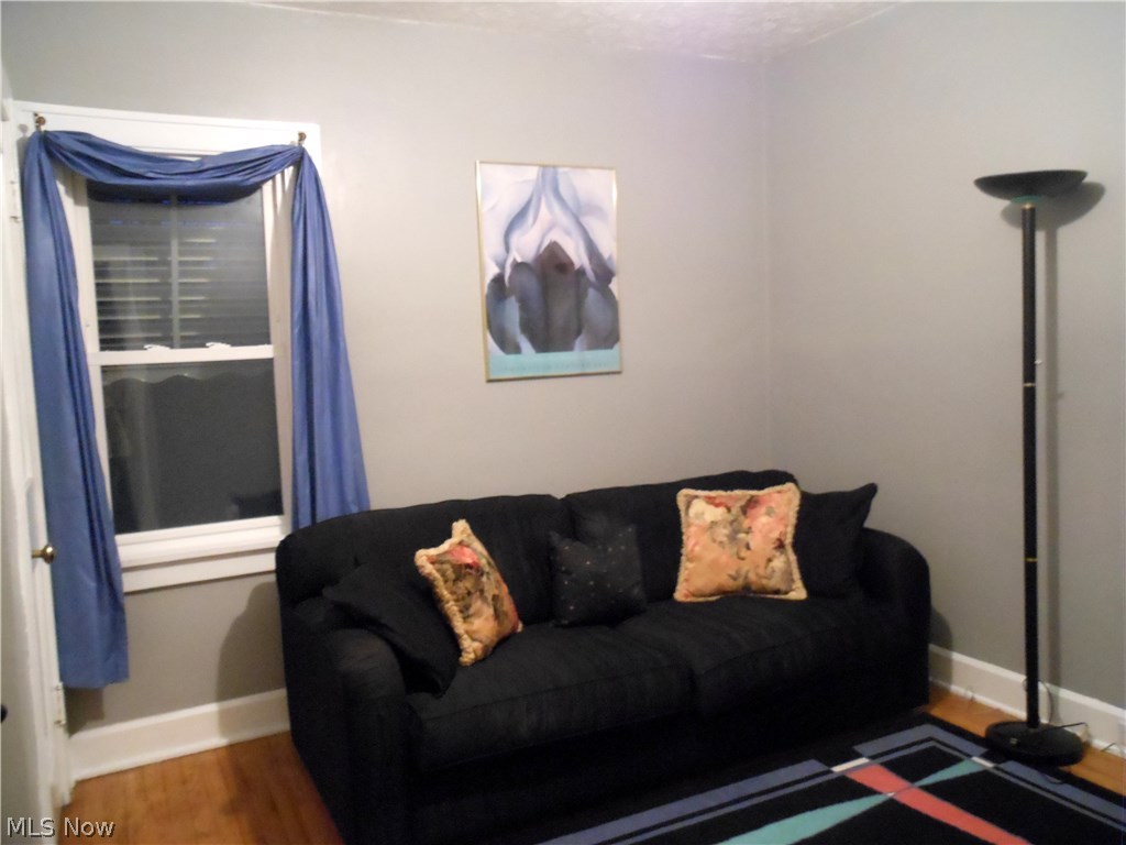 891 Montford Road Cleveland, OH 44121 - Photo 7 of 25 First Floor Bedroom with hardwood floors now used as a TV & Music Room