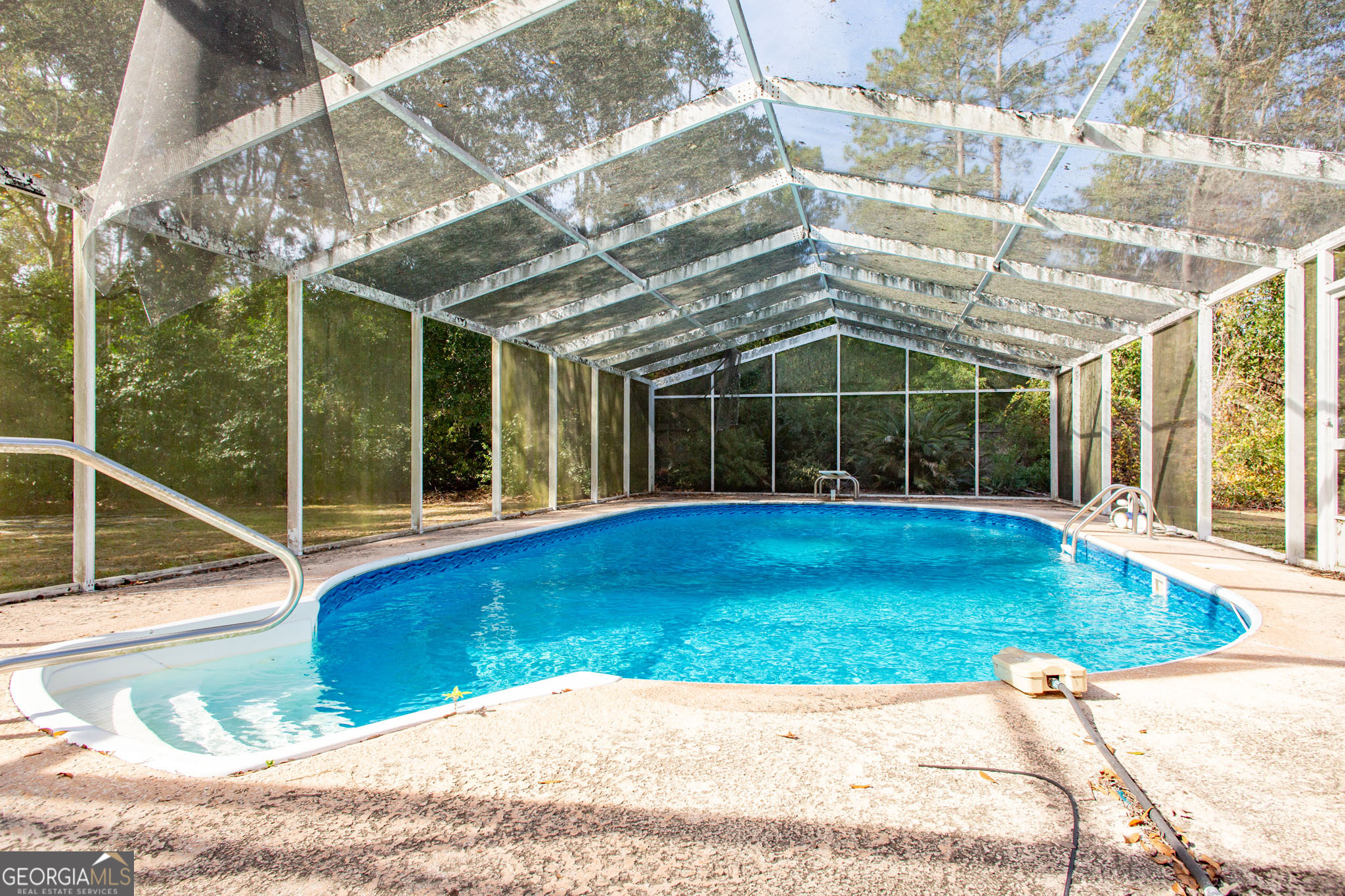 2959 Chadwick Drive Waycross, GA 31501 - Photo 11 of 52 a view of a backyard with a swimming pool