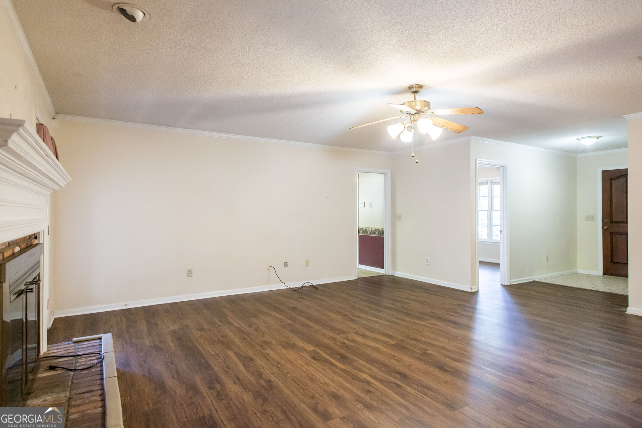 2959 Chadwick Drive Waycross, GA 31501 - Photo 19 of 52 wooden floor in an empty room with a window