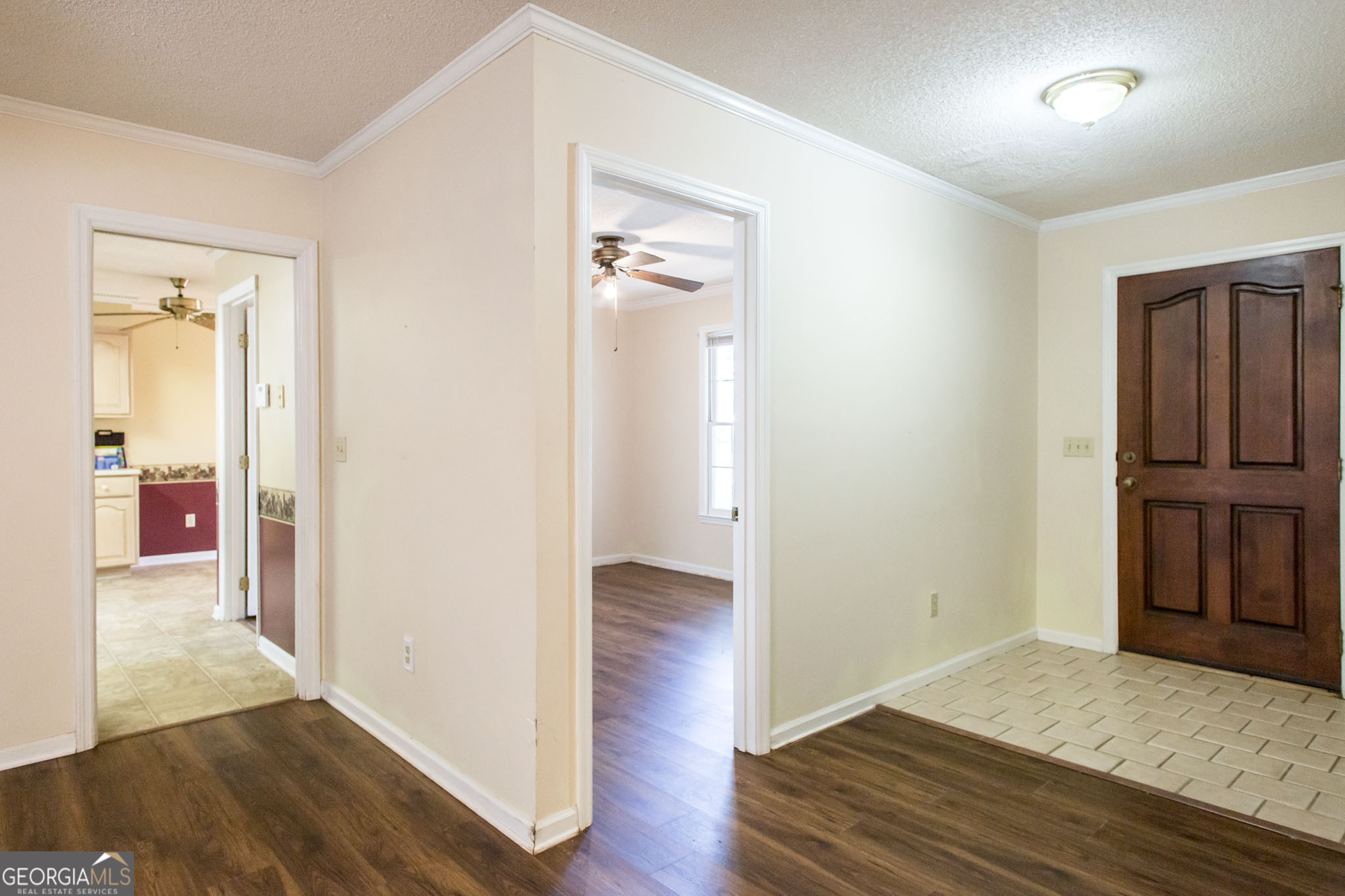 2959 Chadwick Drive Waycross, GA 31501 - Photo 22 of 52 an empty room with wooden floor and a bathroom