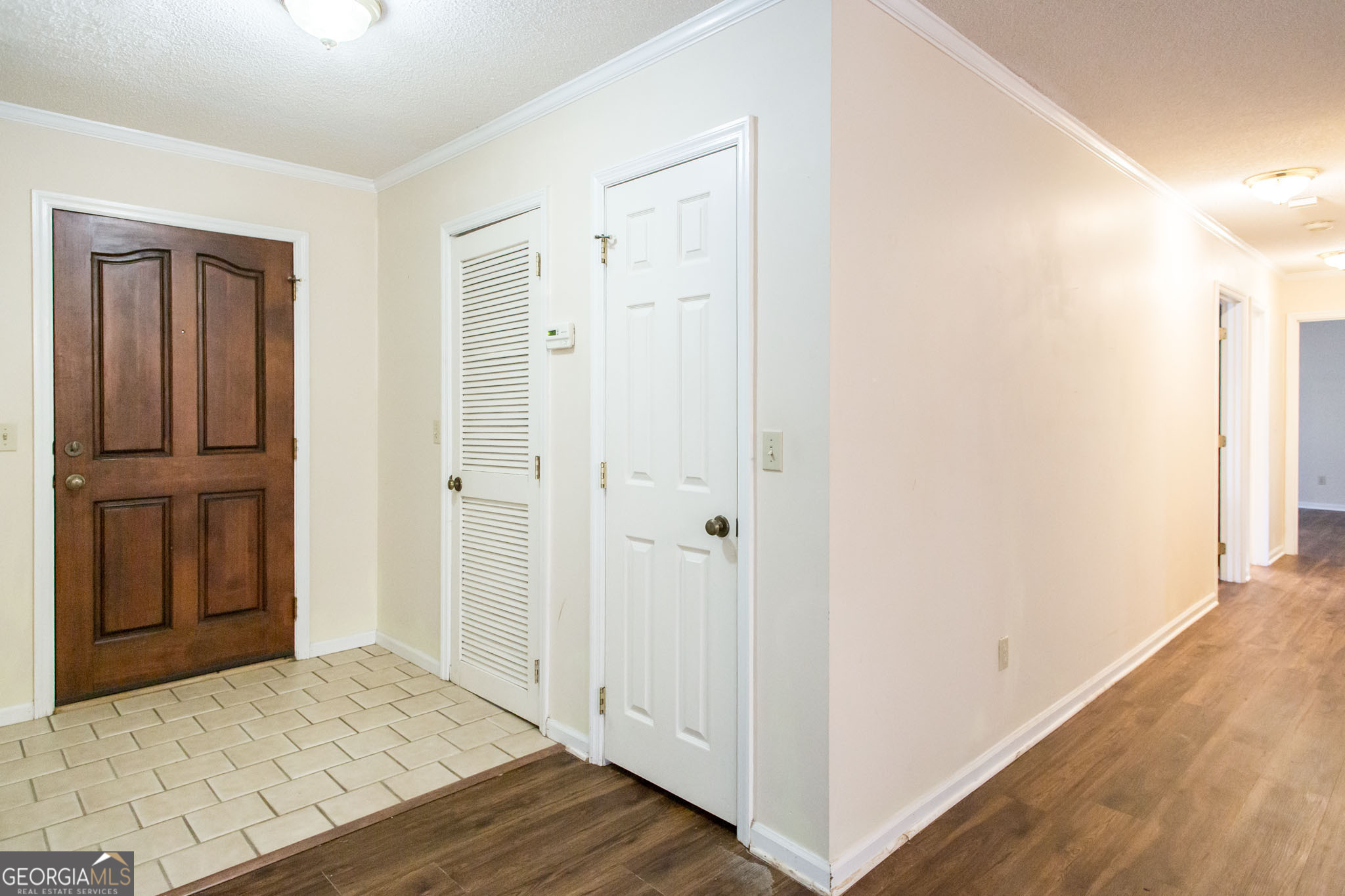 2959 Chadwick Drive Waycross, GA 31501 - Photo 23 of 52 a view of a hallway with wooden floor