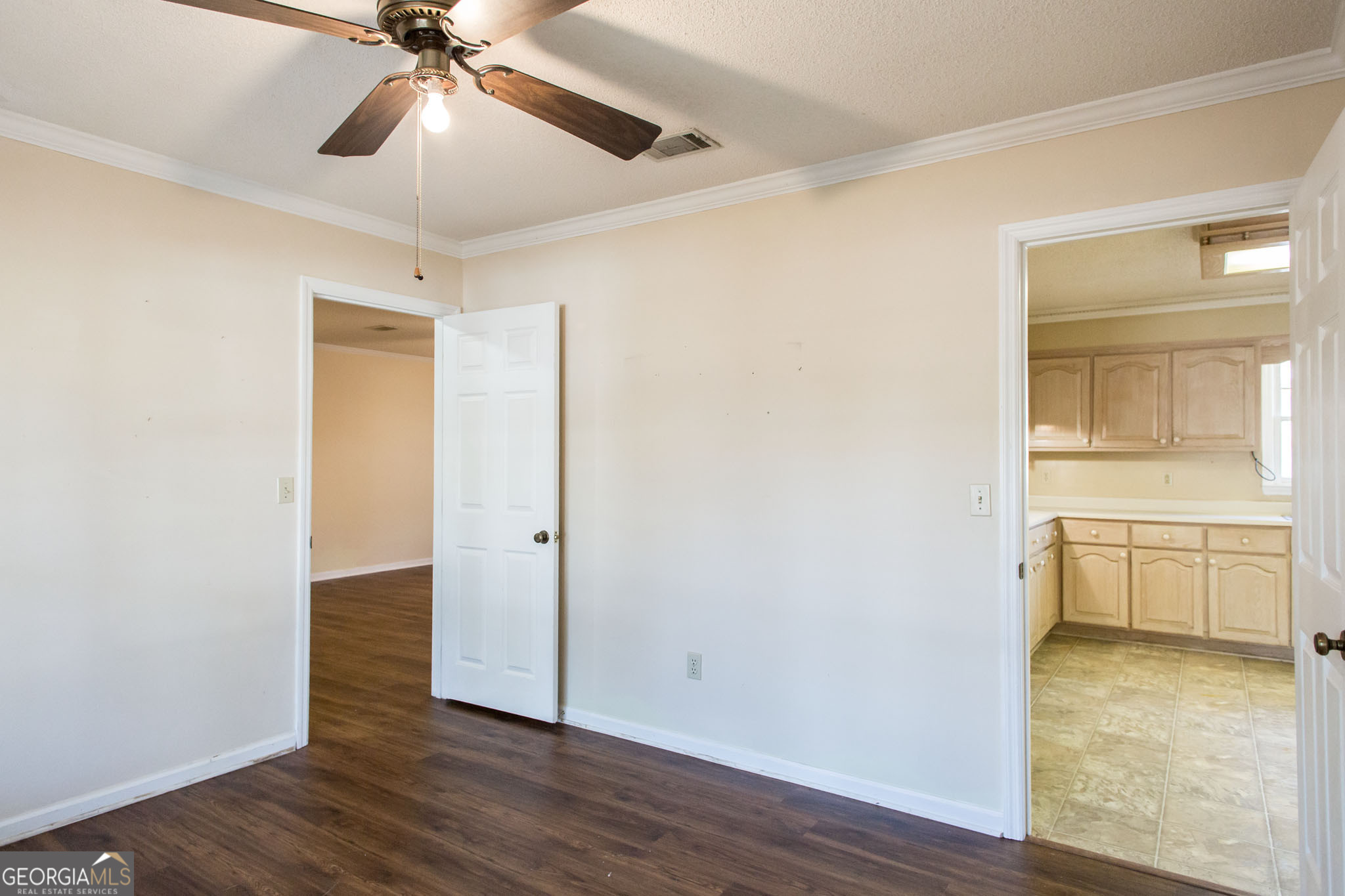 2959 Chadwick Drive Waycross, GA 31501 - Photo 24 of 52 wooden floor in an empty room with a window and wooden floor