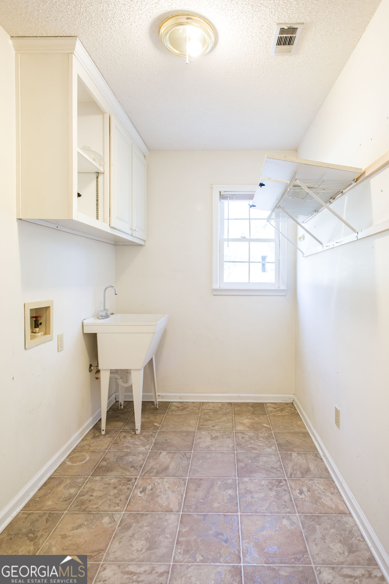 2959 Chadwick Drive Waycross, GA 31501 - Photo 31 of 52 a view of a kitchen with a sink cabinets and a window