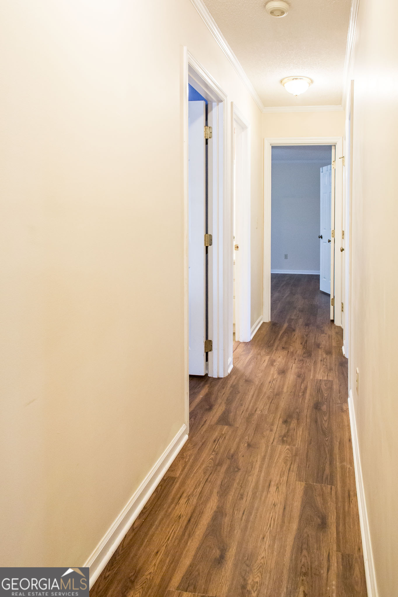 2959 Chadwick Drive Waycross, GA 31501 - Photo 36 of 52 a view of a hallway with wooden floor