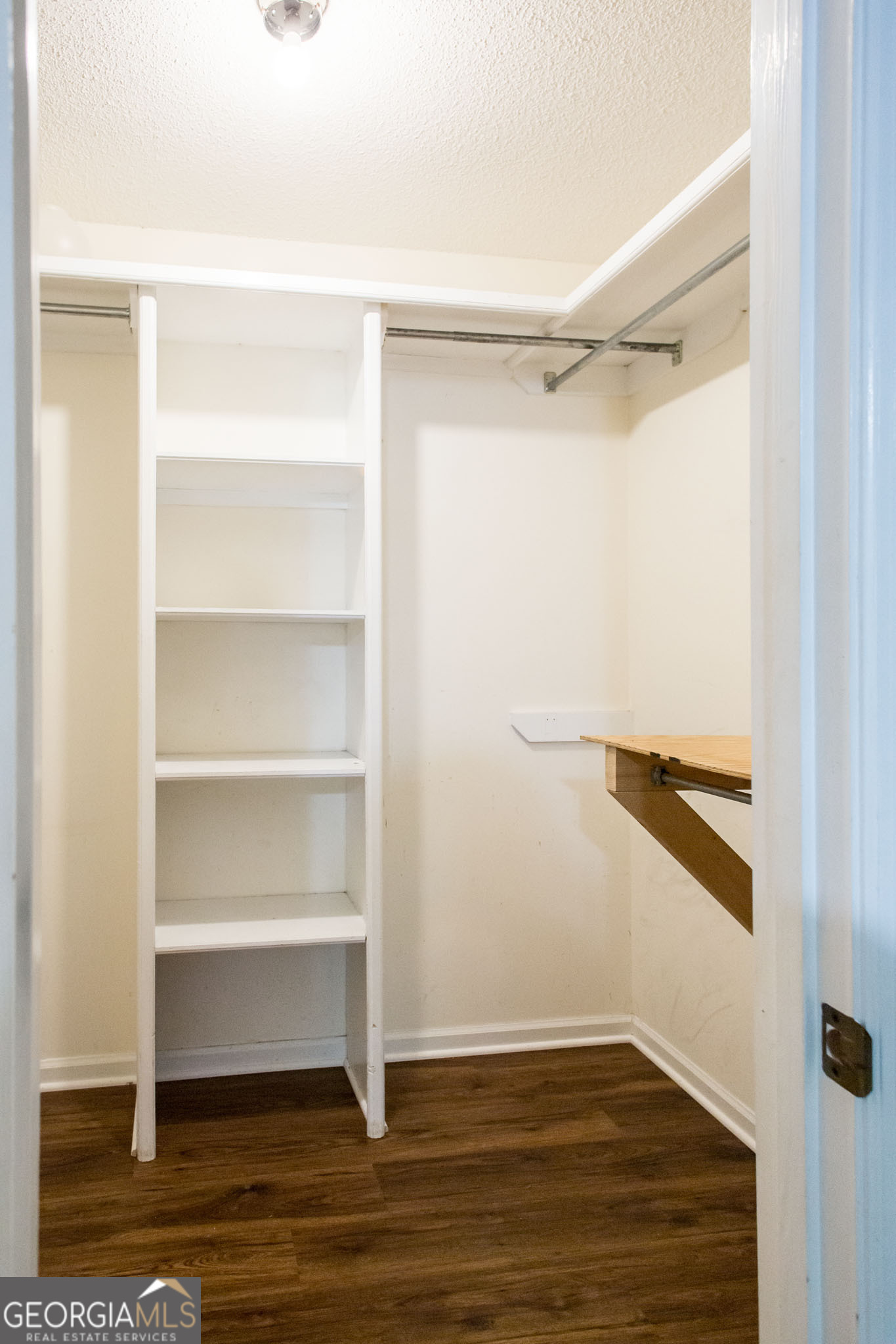 2959 Chadwick Drive Waycross, GA 31501 - Photo 45 of 52 a view of walk in closet with empty racks