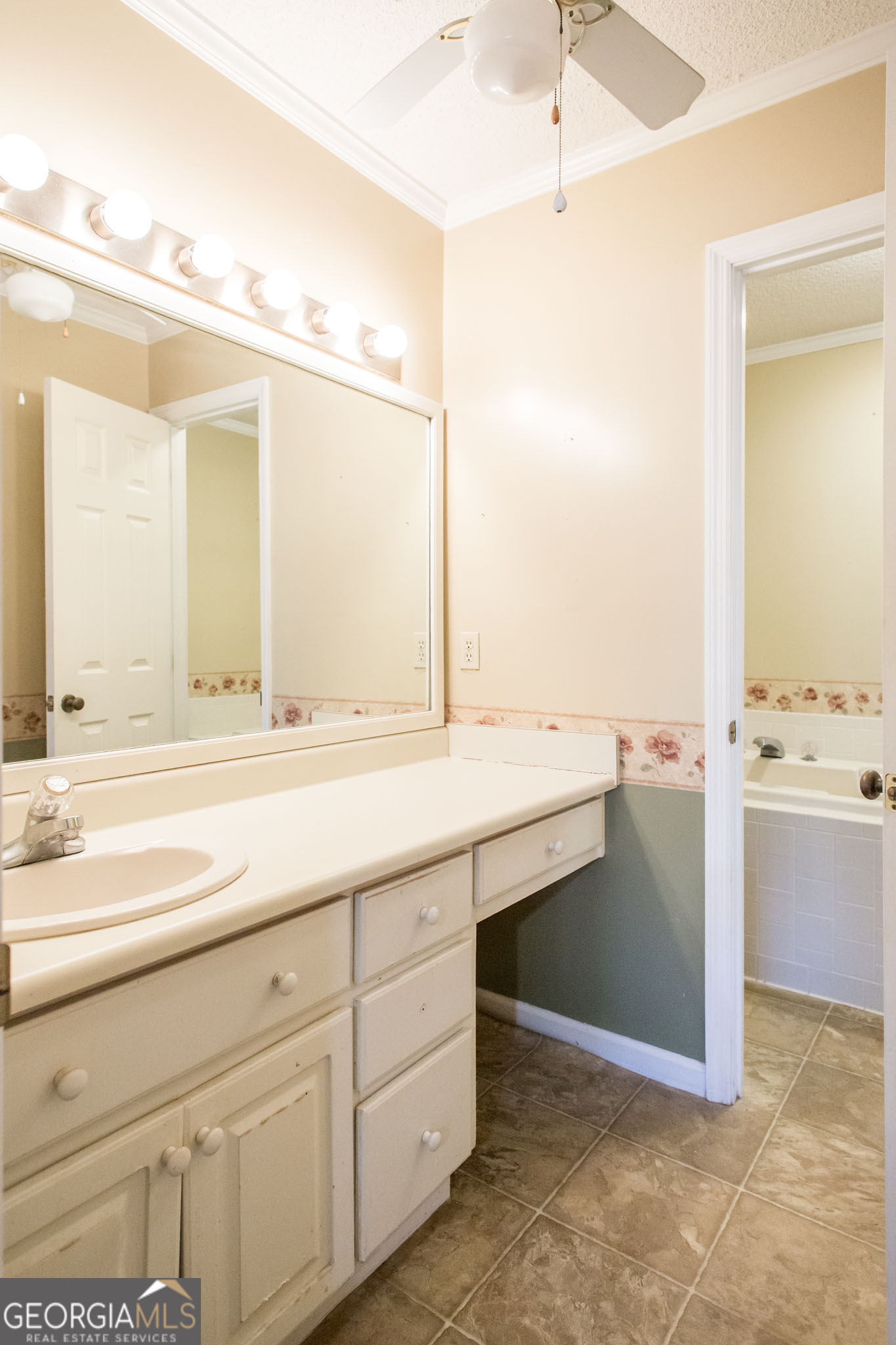 2959 Chadwick Drive Waycross, GA 31501 - Photo 47 of 52 a bathroom with a sink and a mirror