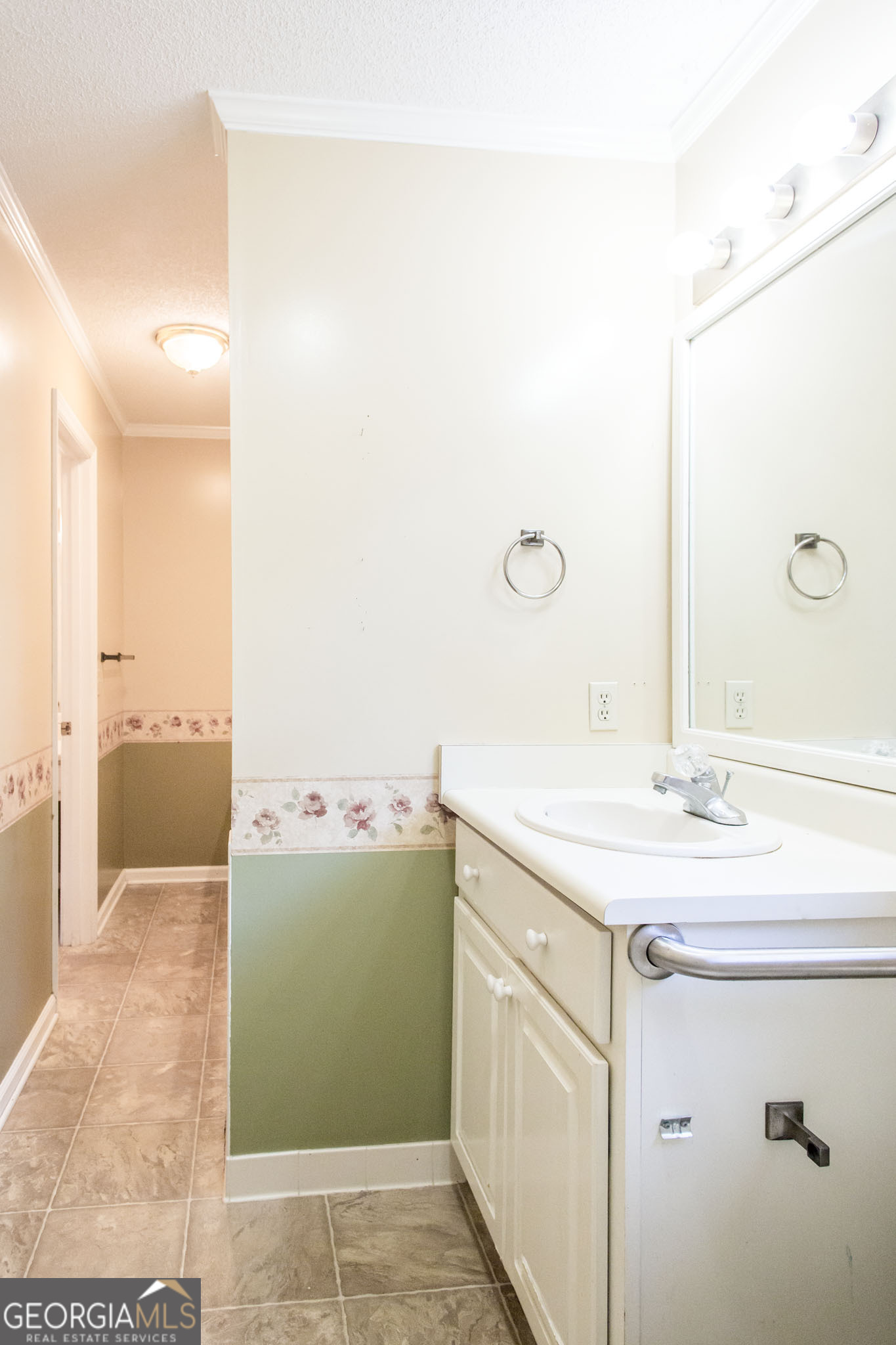 2959 Chadwick Drive Waycross, GA 31501 - Photo 52 of 52 a bathroom with a sink and mirror