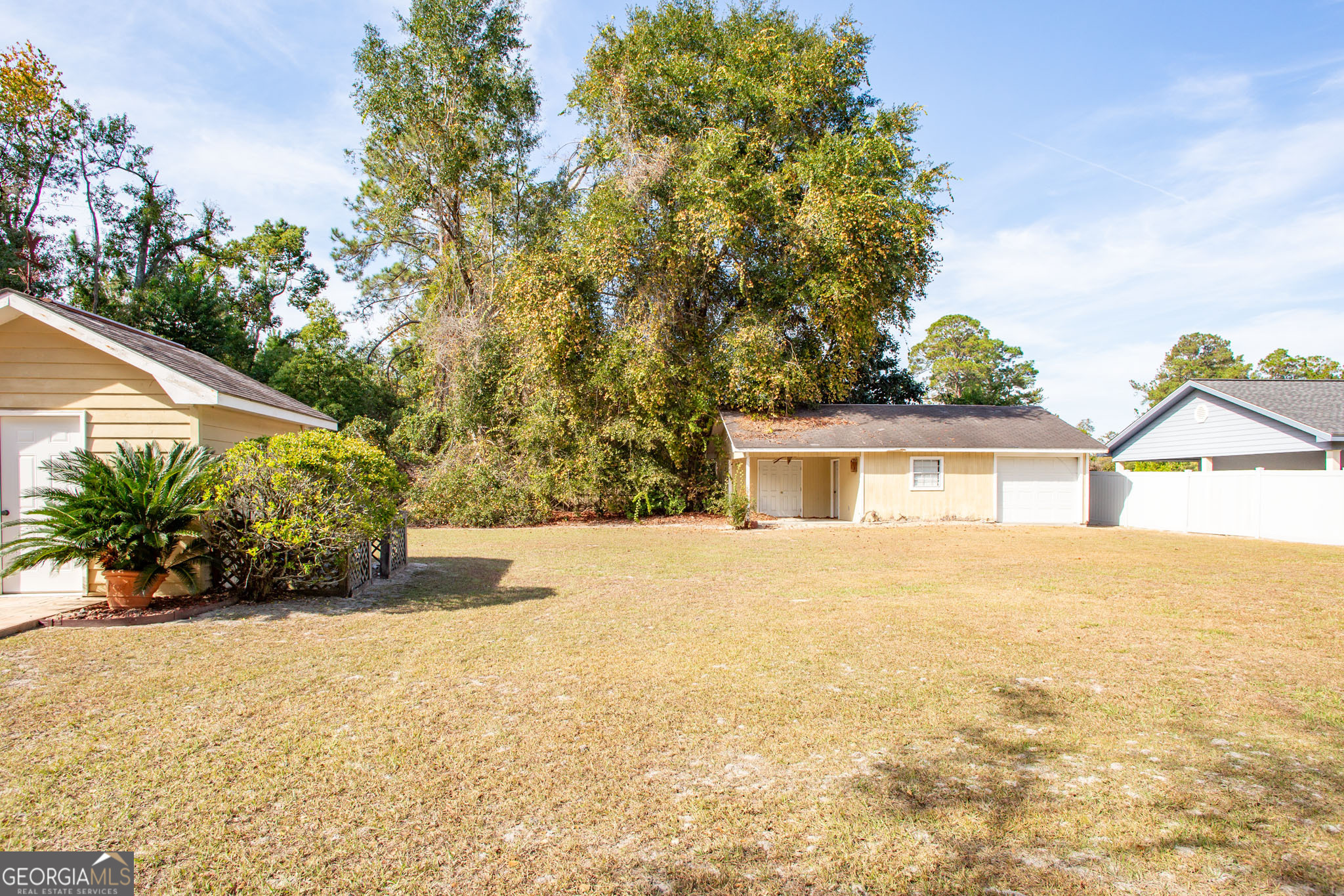 2959 Chadwick Drive Waycross, GA 31501 - Photo 9 of 52 a front view of a house with a garden