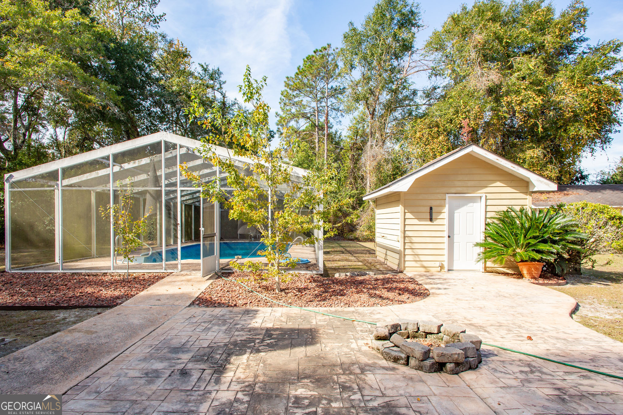 2959 Chadwick Drive Waycross, GA 31501 - Photo 10 of 52 a front view of a house with a yard and potted plants