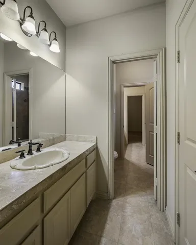 an empty room with a empty space and a ceiling fan