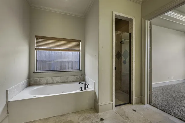a kitchen with granite countertop white cabinets and sink