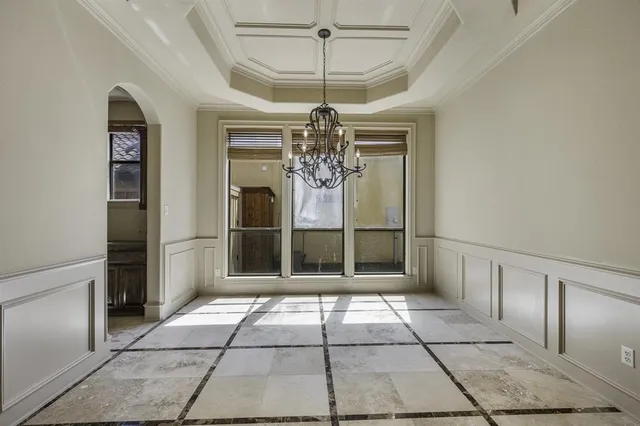 a view of a livingroom with furniture and staircase