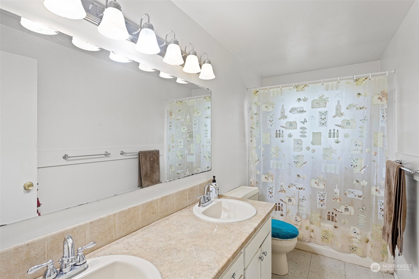 21820 7th Place West Bothell, WA 98021 - Photo 8 of 14 a spacious bathroom with a granite countertop sink a toilet and a mirror