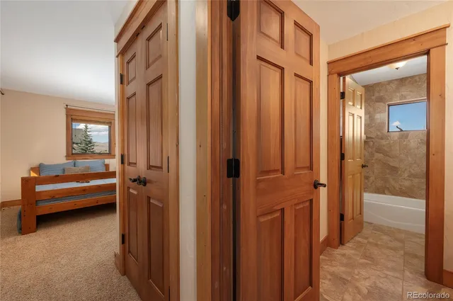 a view of a bedroom with furniture and windows