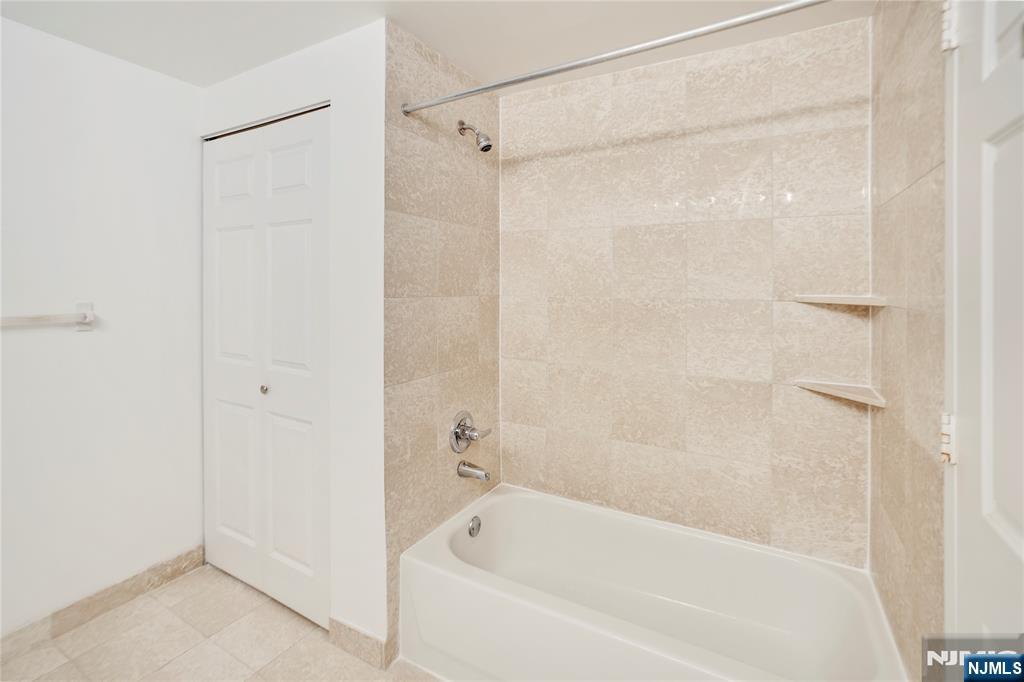100 Old Palisade Road, Unit 2709 Fort Lee, NJ 07024 - Photo 10 of 15 a bathroom with a bathtub and a shower