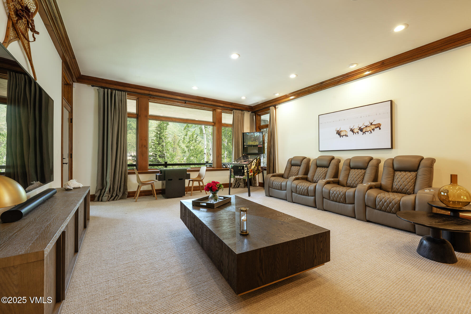 185 Forest Road Vail, CO 81657 - Photo 5 of 13 a living room with furniture and a flat screen tv