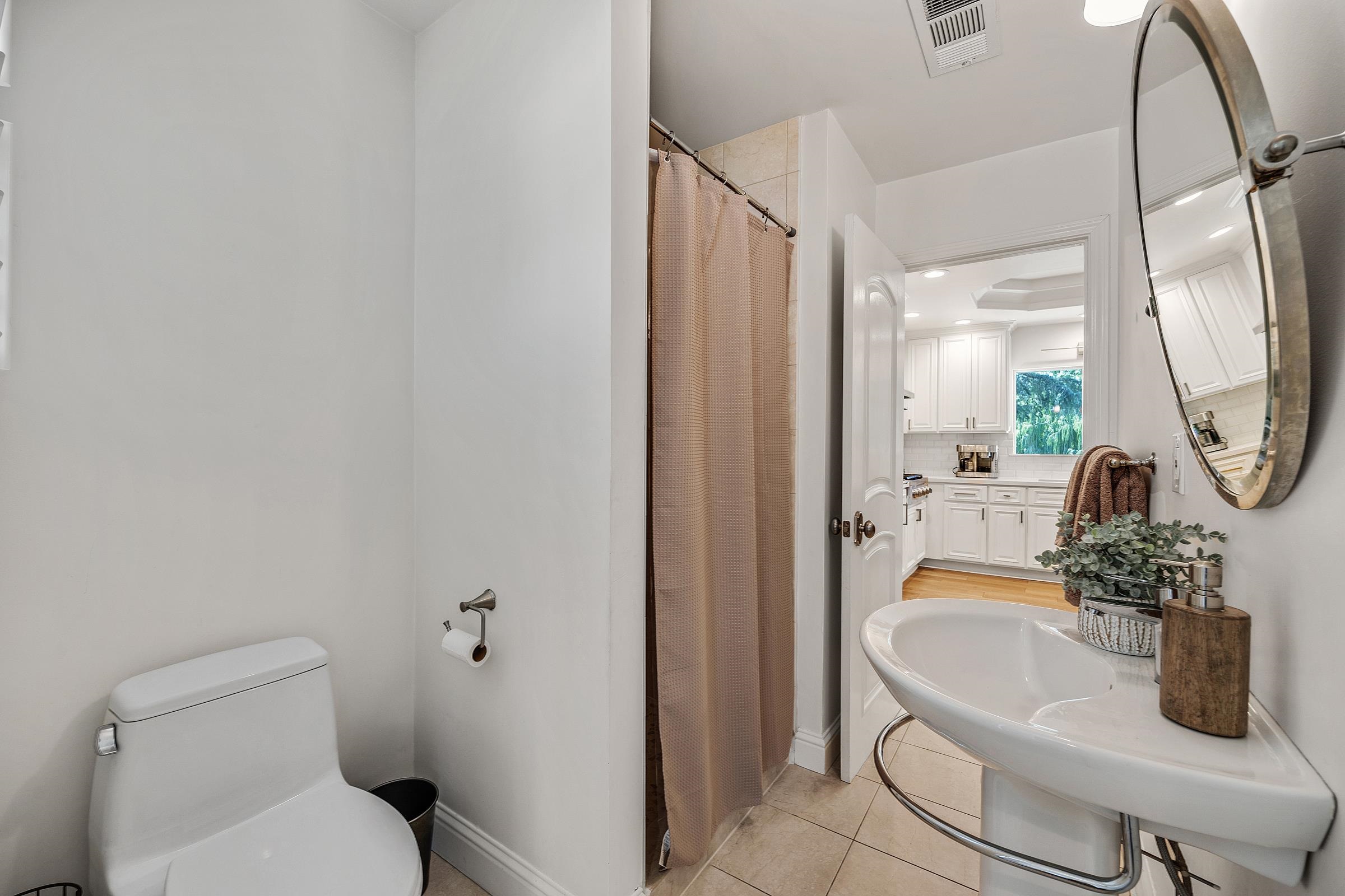 3144 Roundhill Road Alamo, CA 94507 - Photo 14 of 58 a bathroom with a sink a toilet and a mirror
