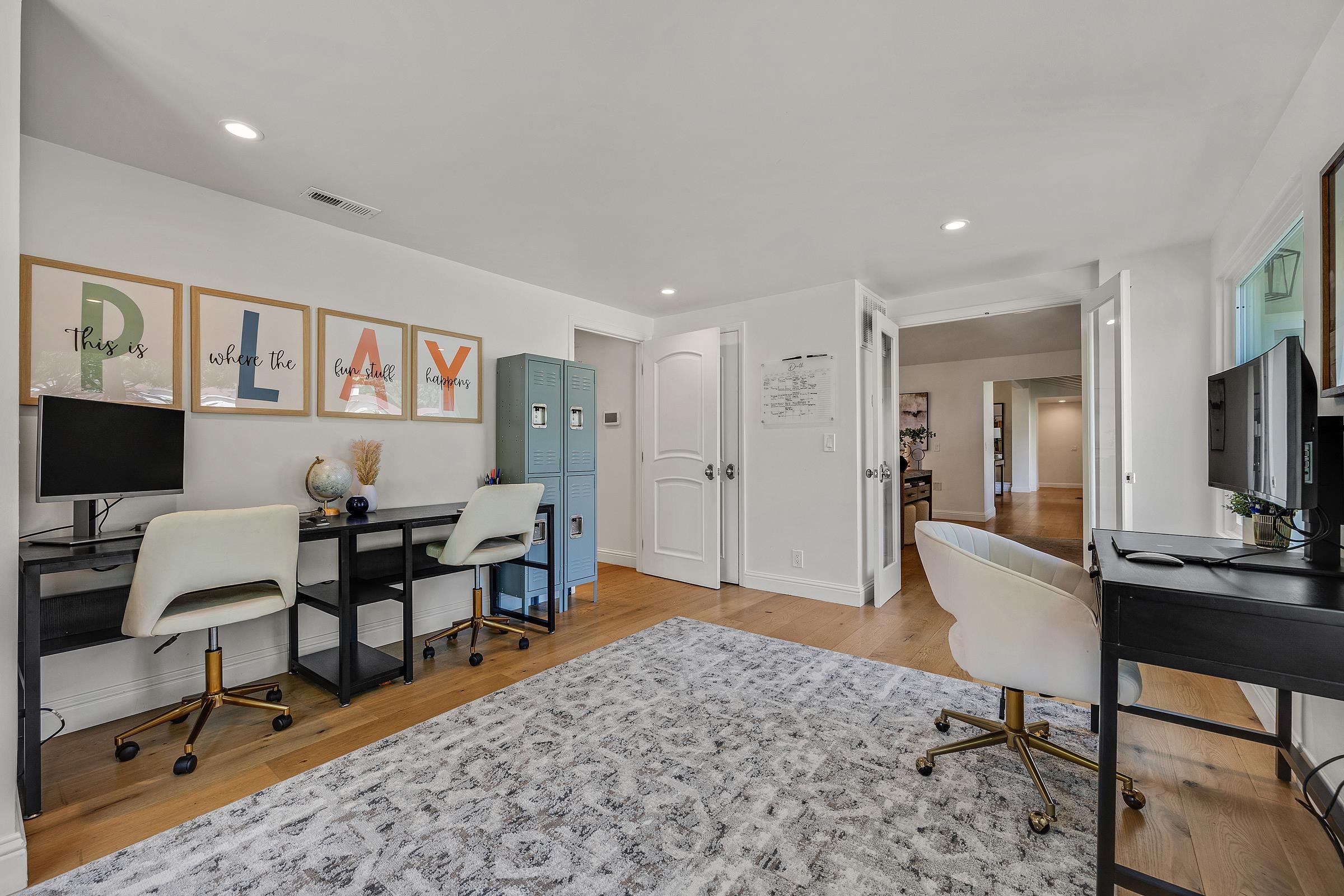 3144 Roundhill Road Alamo, CA 94507 - Photo 17 of 58 a living room with furniture a rug and a flat screen tv