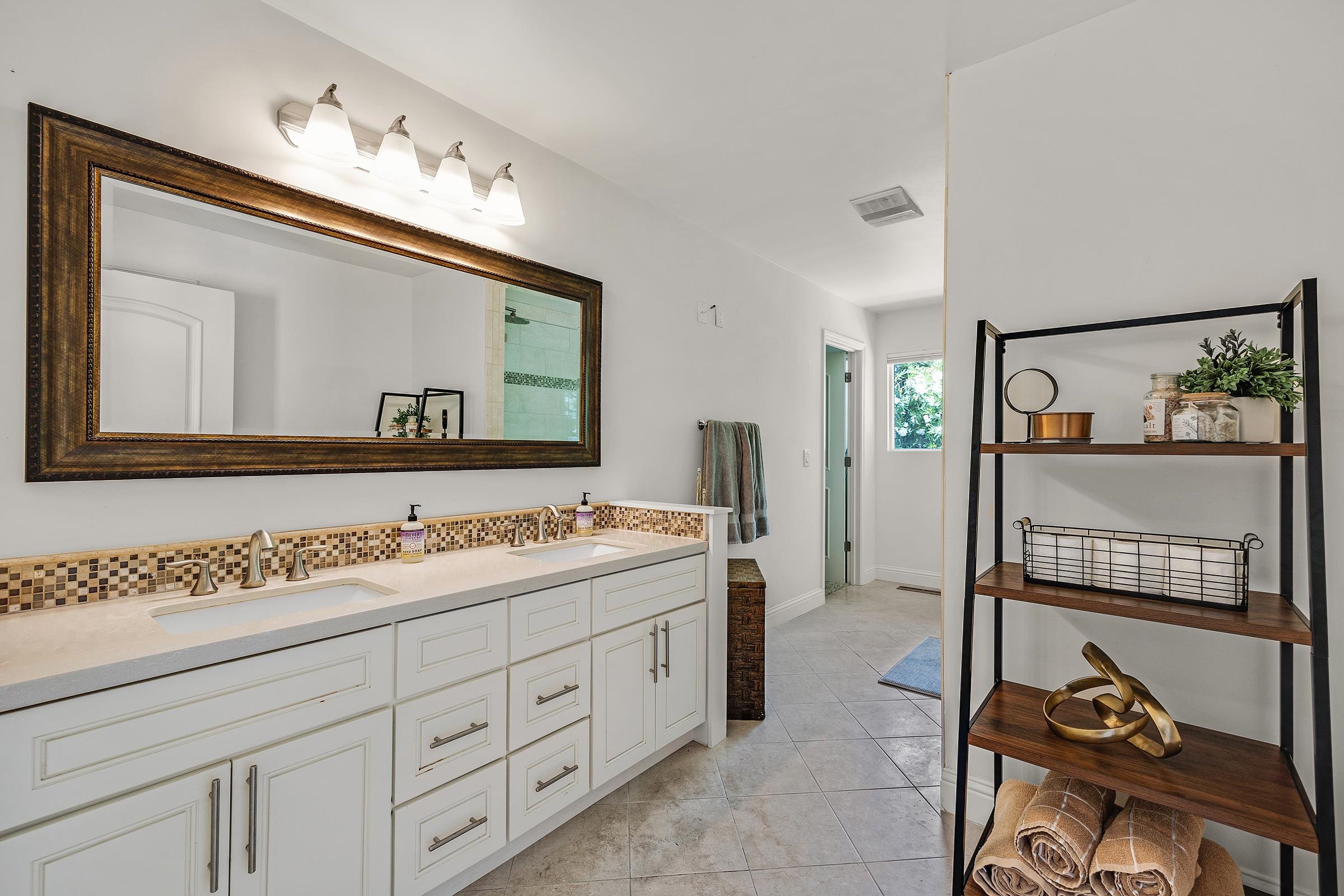 3144 Roundhill Road Alamo, CA 94507 - Photo 28 of 58 a bathroom with a double vanity sink and a mirror