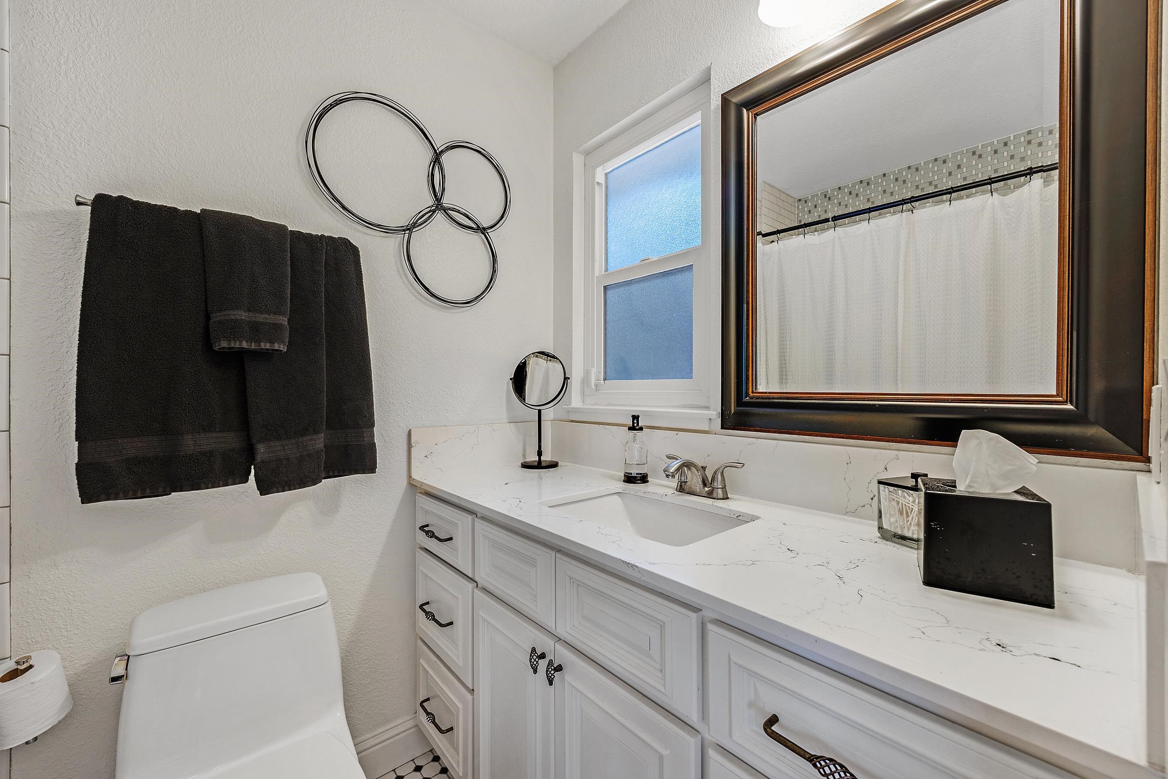 3144 Roundhill Road Alamo, CA 94507 - Photo 31 of 58 a bathroom with a double vanity sink and mirror