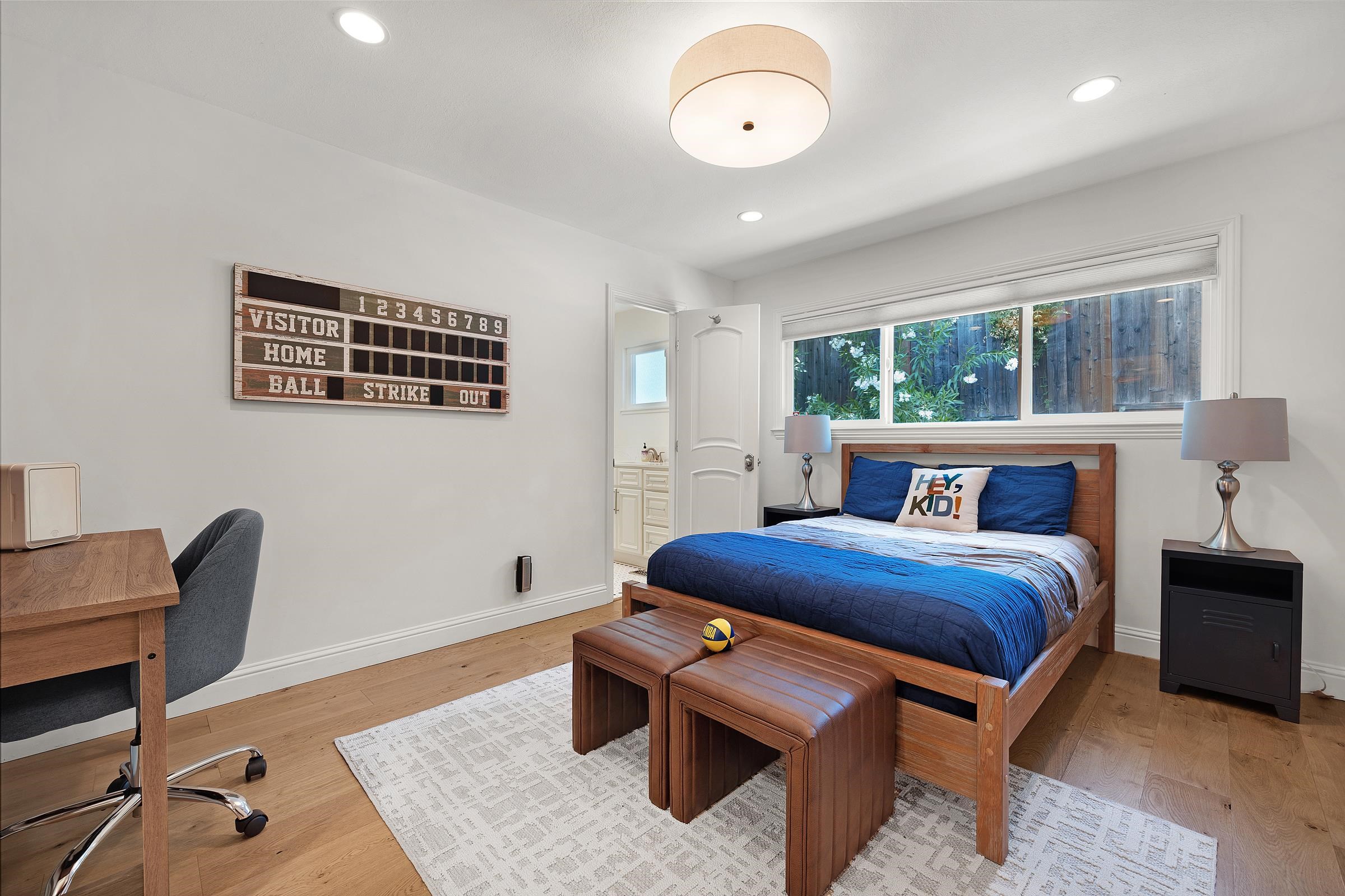 3144 Roundhill Road Alamo, CA 94507 - Photo 37 of 58 a bedroom with a bed and wooden floor