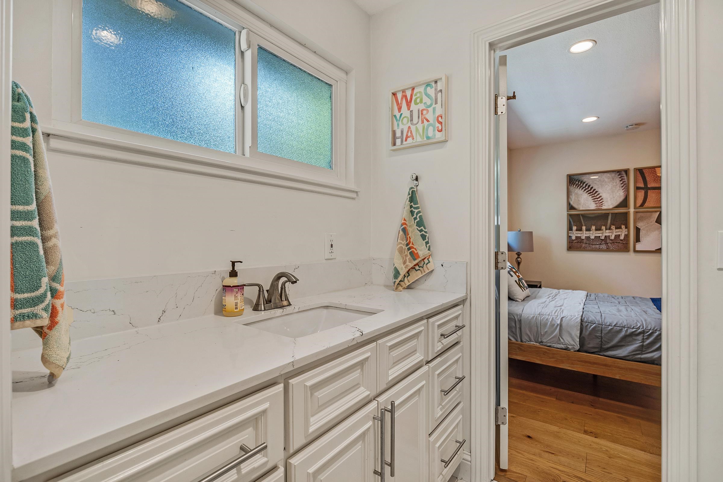 3144 Roundhill Road Alamo, CA 94507 - Photo 39 of 58 a en suite bathroom with a sink and a mirror