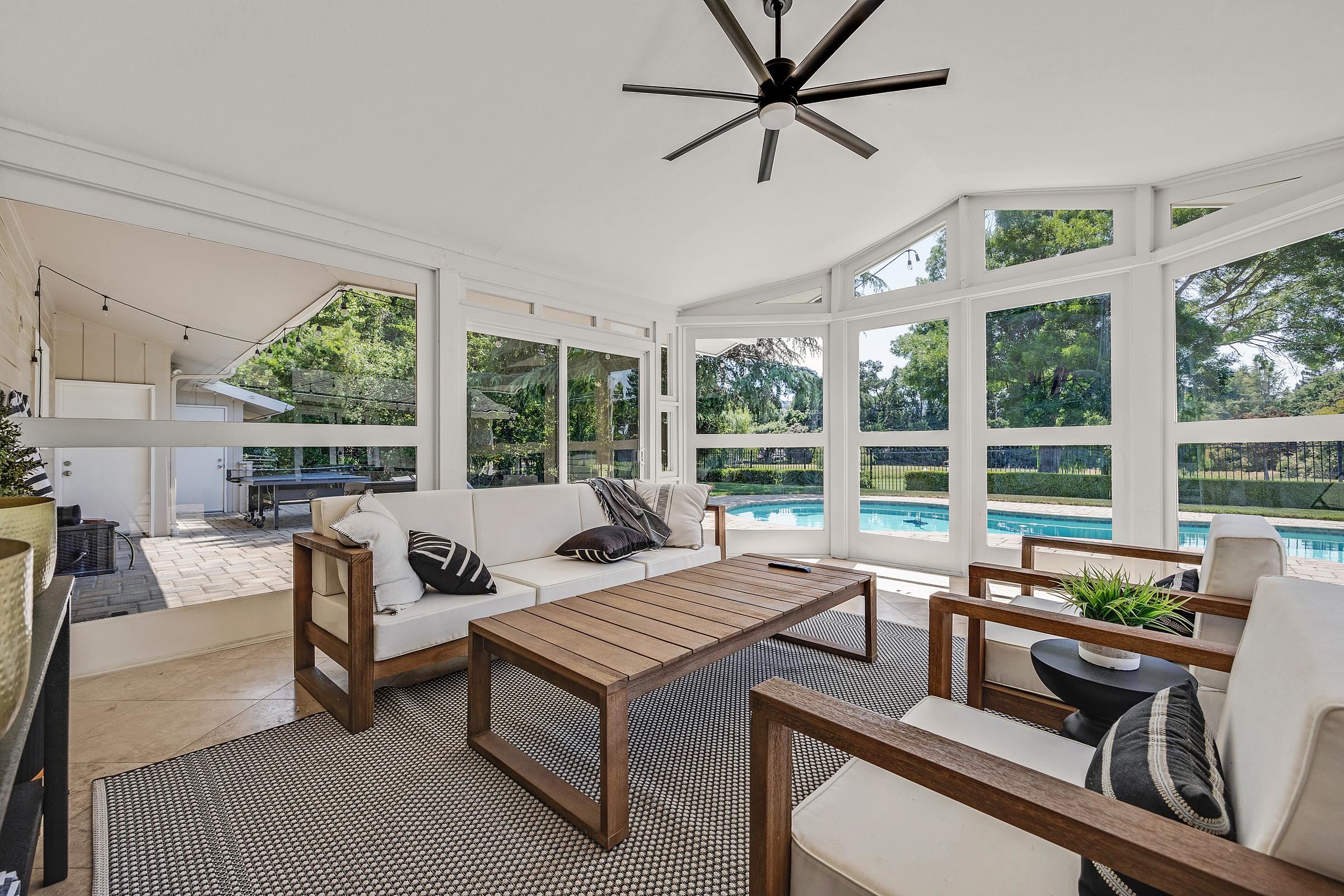 3144 Roundhill Road Alamo, CA 94507 - Photo 43 of 58 a living room with furniture and a large window