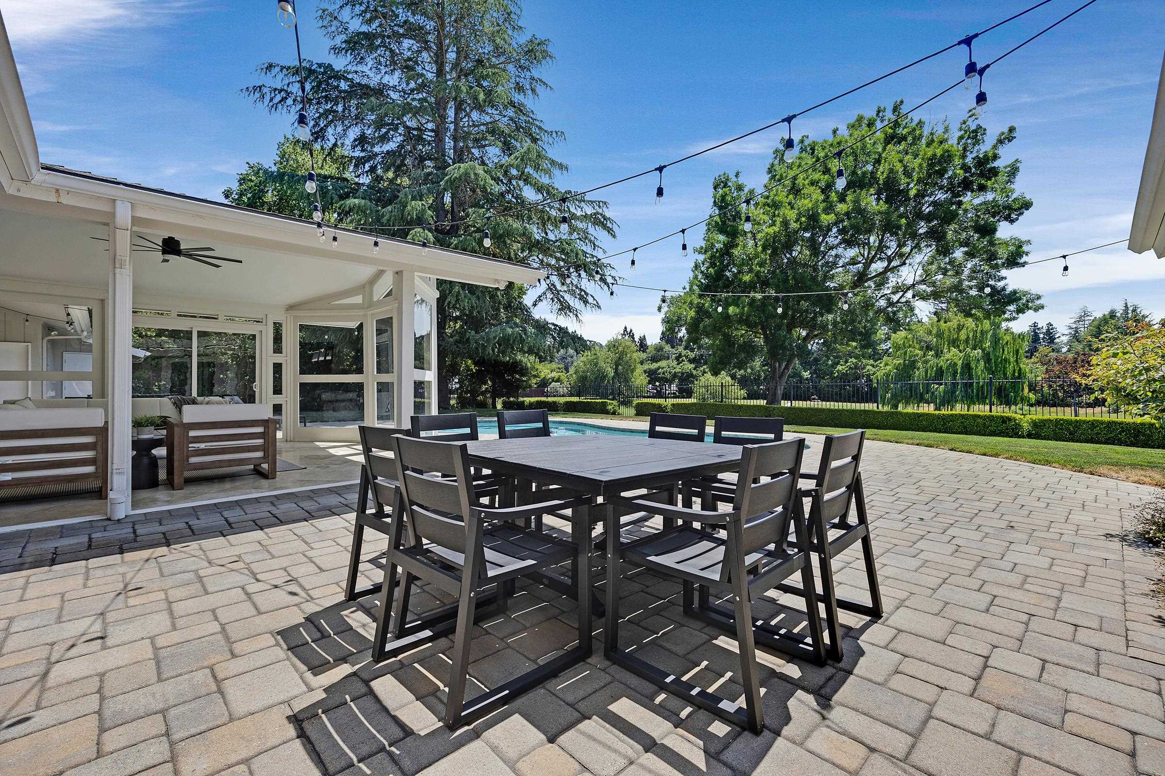 3144 Roundhill Road Alamo, CA 94507 - Photo 45 of 58 a patio with table and chairs and potted plants