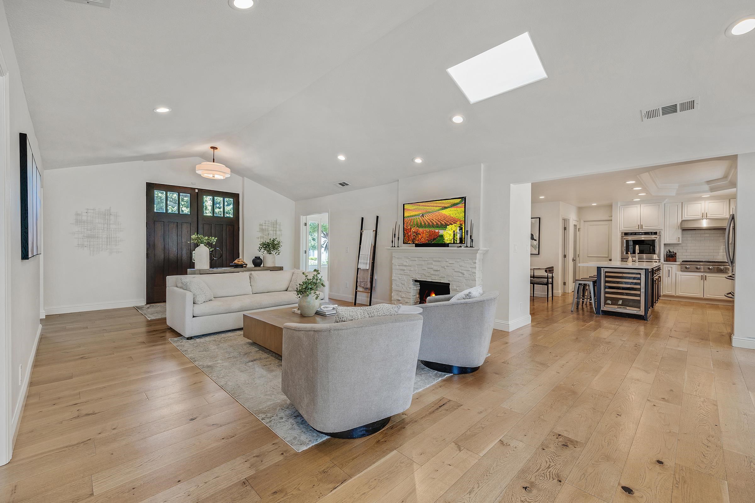 3144 Roundhill Road Alamo, CA 94507 - Photo 6 of 58 a living room with couches and kitchen view with wooden floor