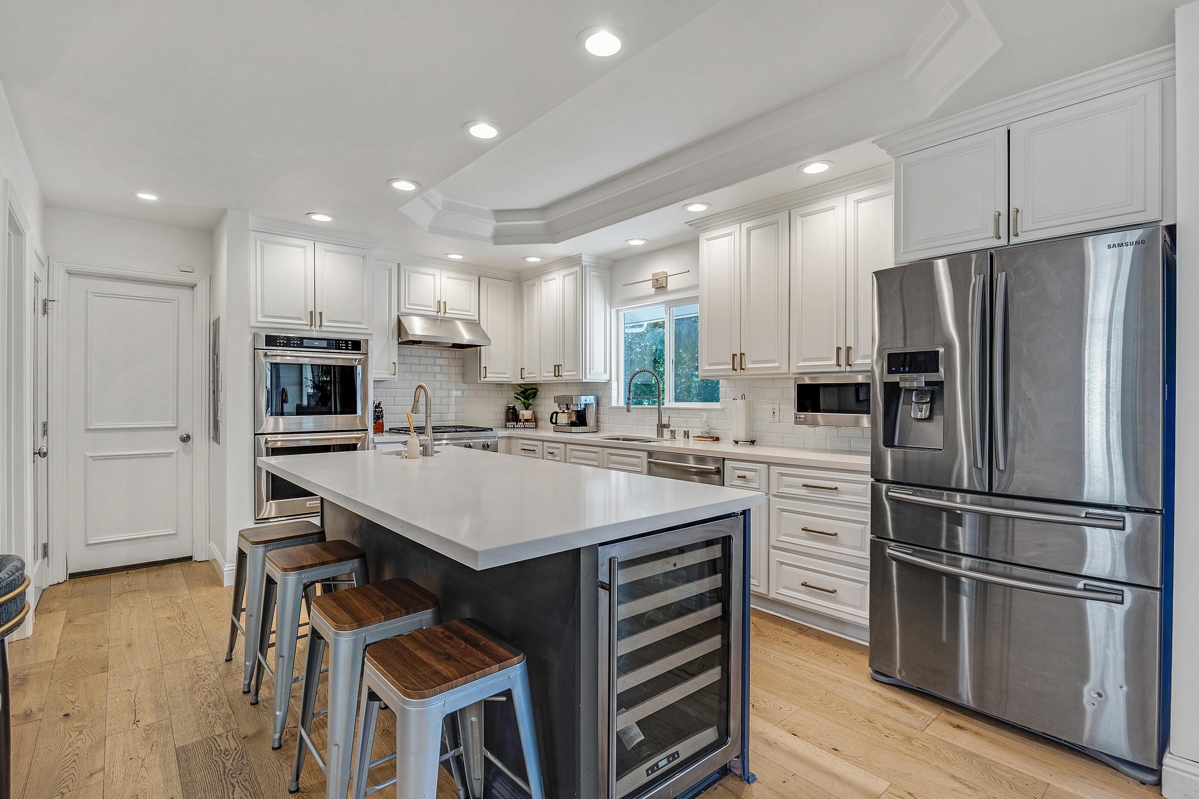 3144 Roundhill Road Alamo, CA 94507 - Photo 7 of 58 a kitchen with a refrigerator a sink and cabinets