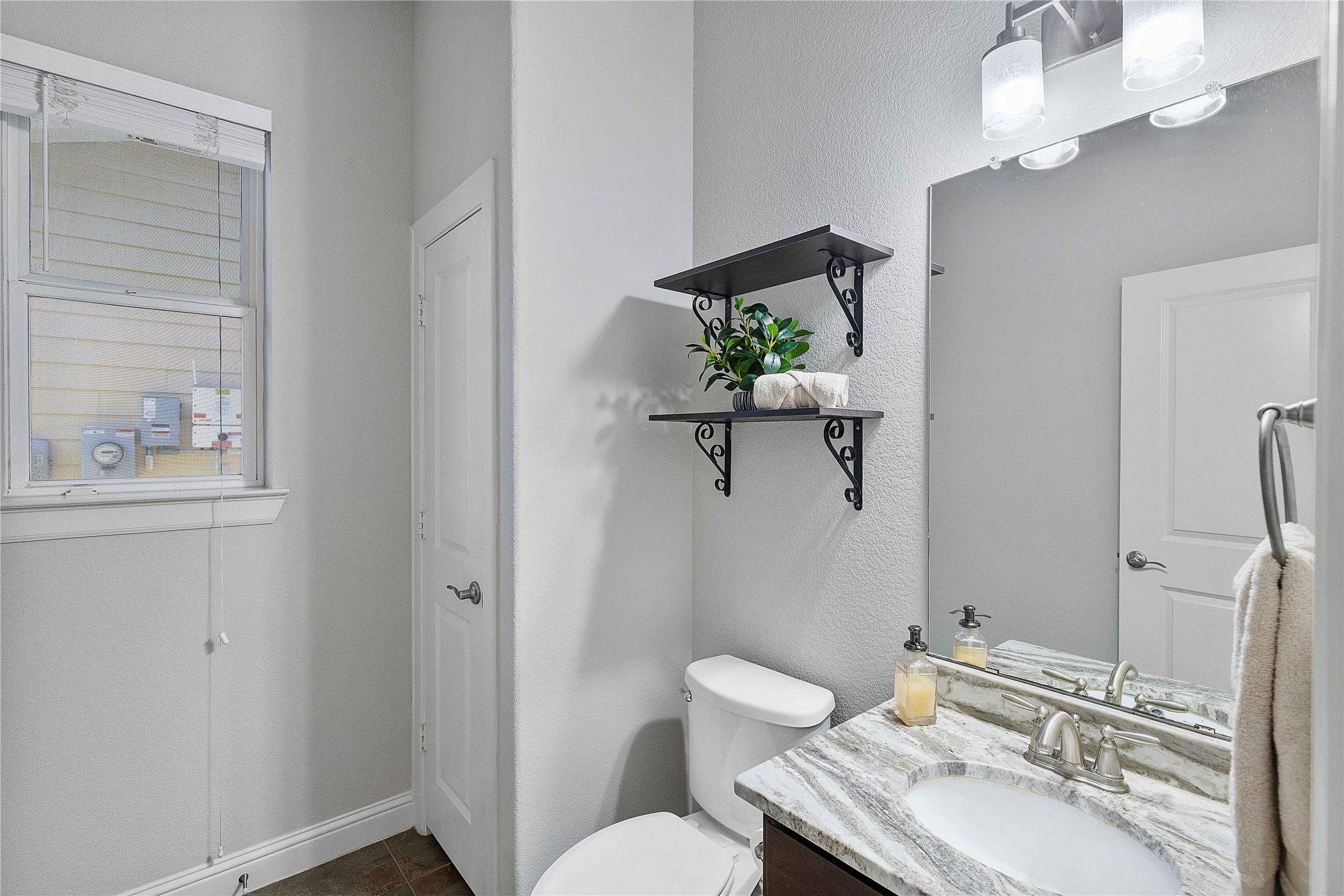 29539 Monona Terrace Court Spring, TX 77386 - Photo 13 of 50 This half bath is right off the main living space, perfect for guests and convenience.