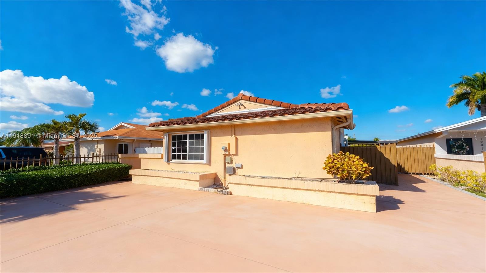 12421 Southwest 193rd Street Miami, FL 33177 - Photo 3 of 23 a view of a house with a yard