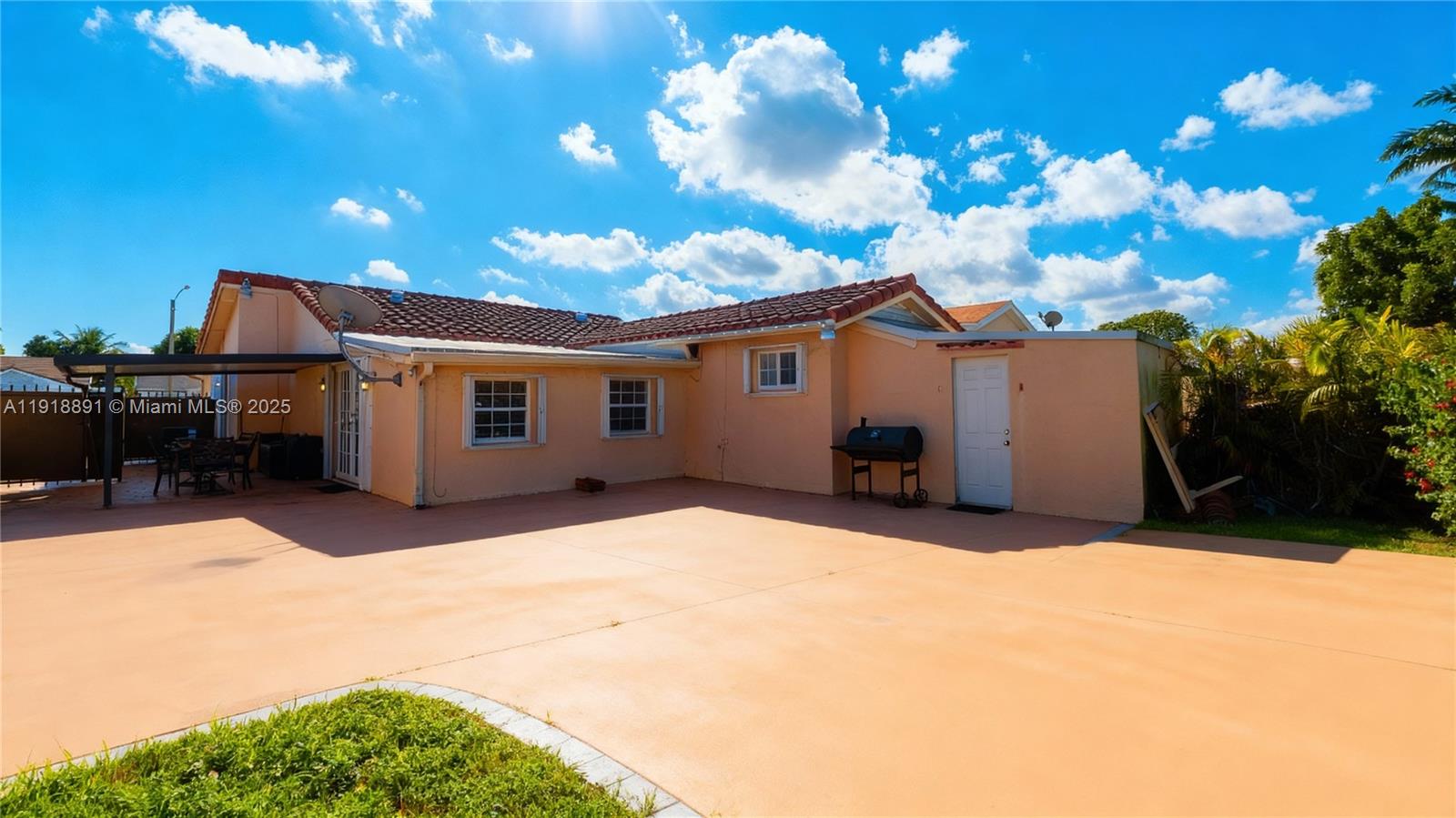 12421 Southwest 193rd Street Miami, FL 33177 - Photo 4 of 23 a view of a house with a yard